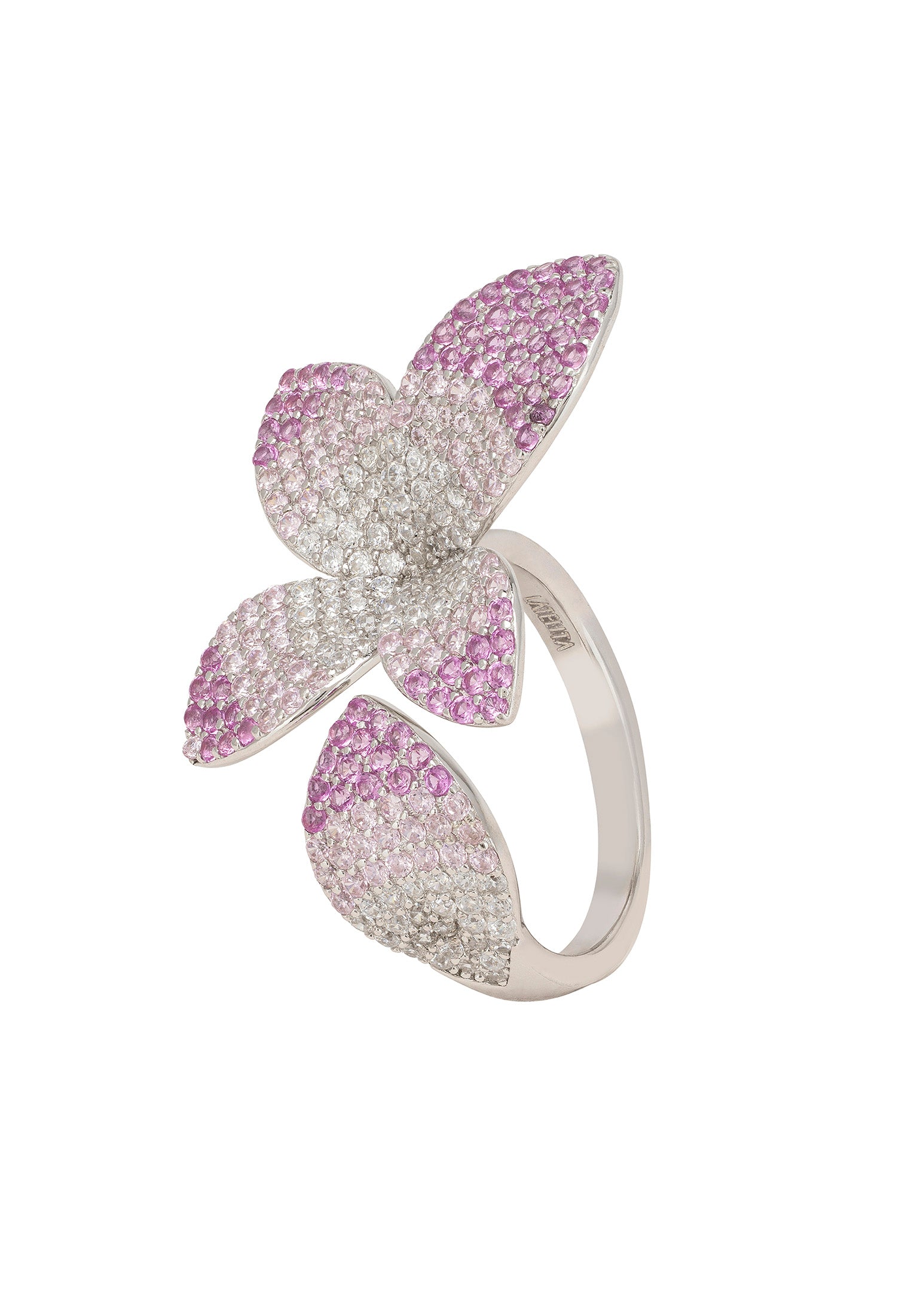 Silver ring with pink gemstone accents on a white background