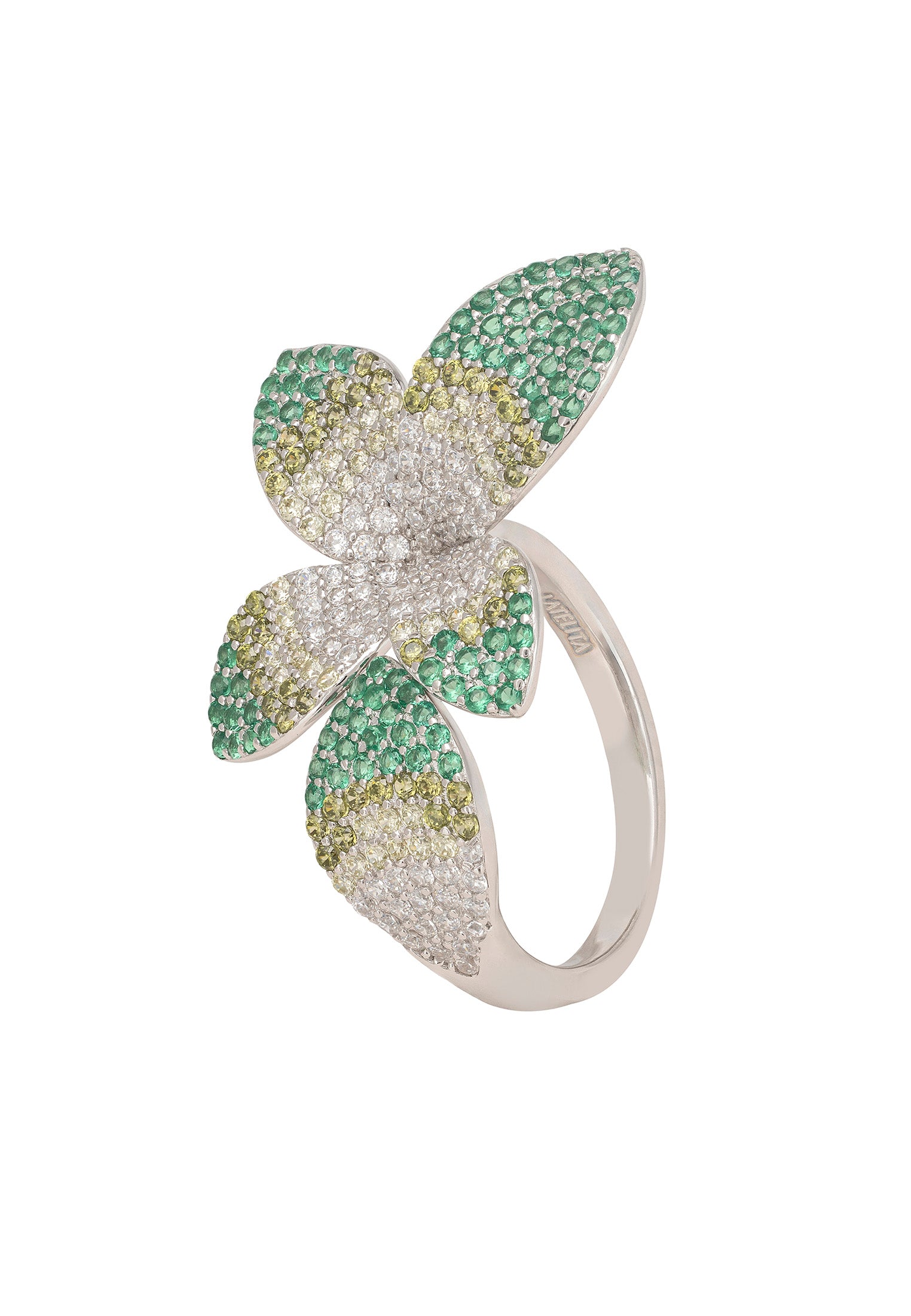 Flower-shaped ring with green and gold gemstones on a white background