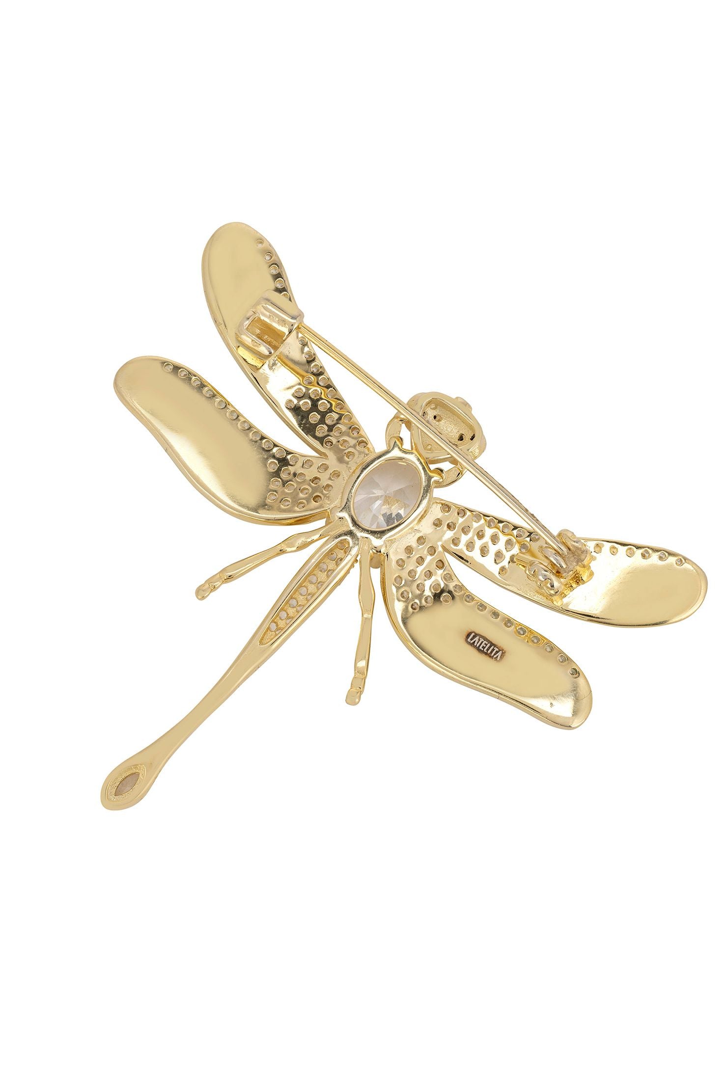 Gold dragonfly-shaped brooch on a white background