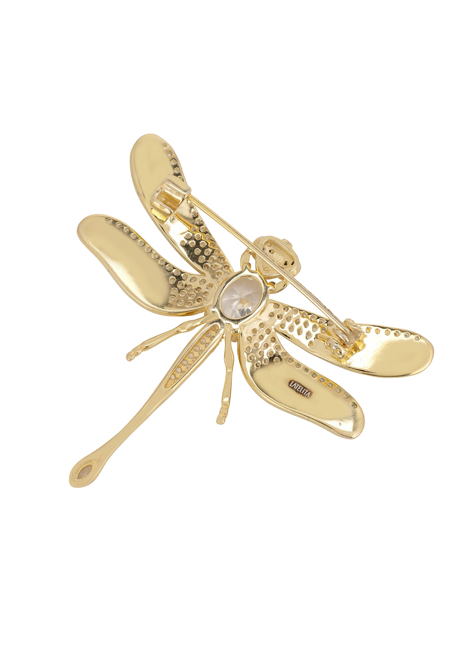 Gold dragonfly-shaped brooch on a white background