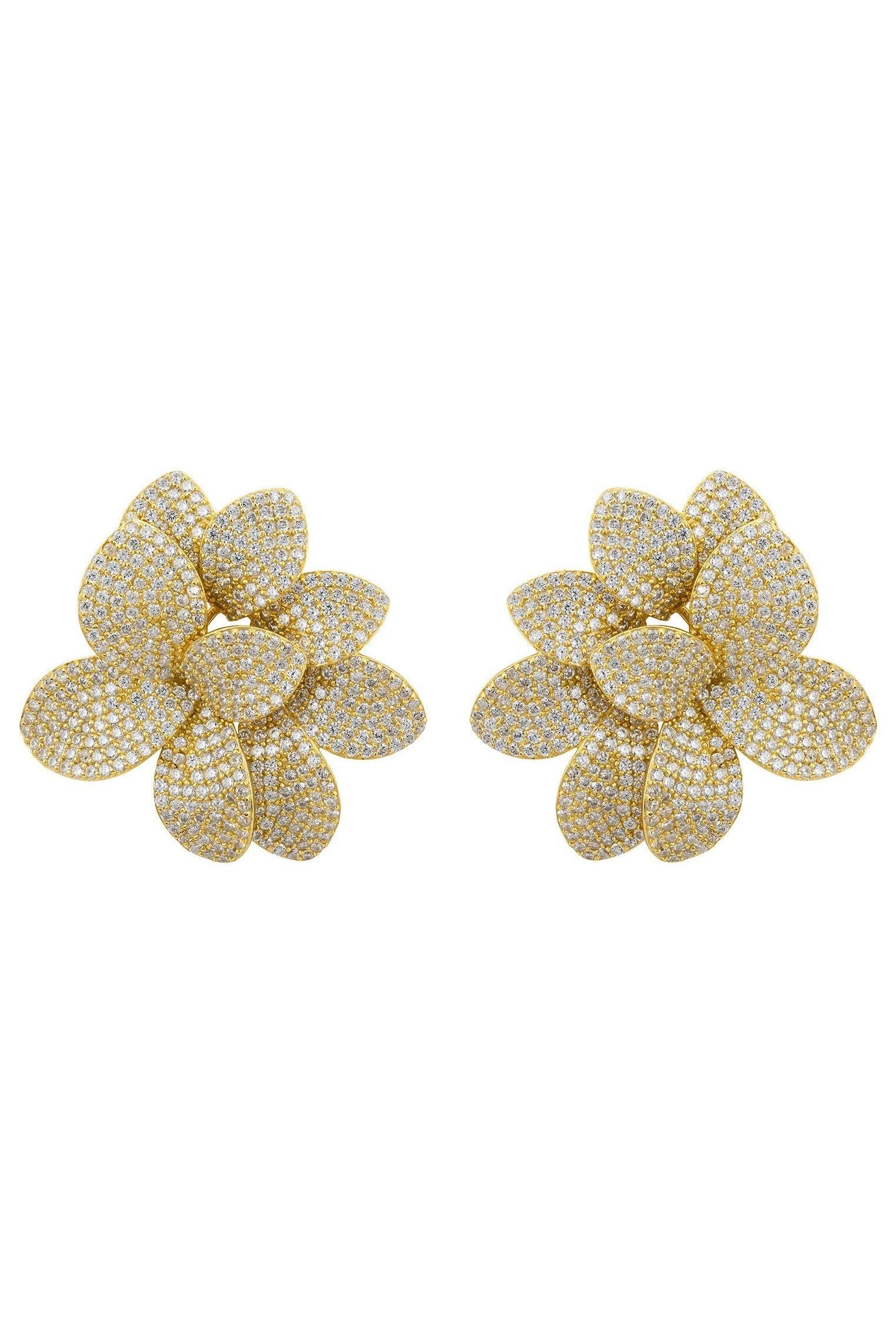 Gold flower earrings.