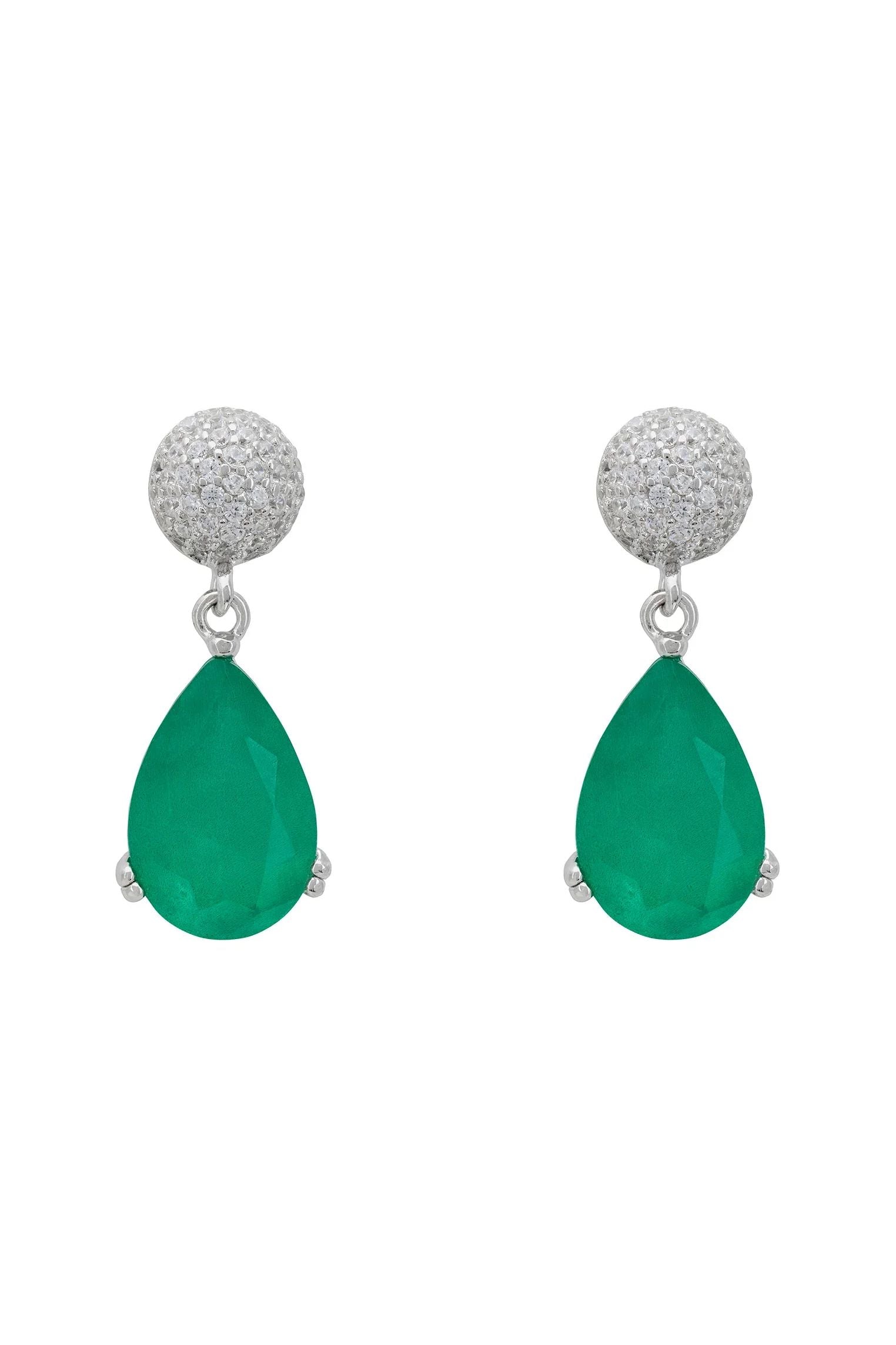 Diamond stud and teardrop emerald earrings.