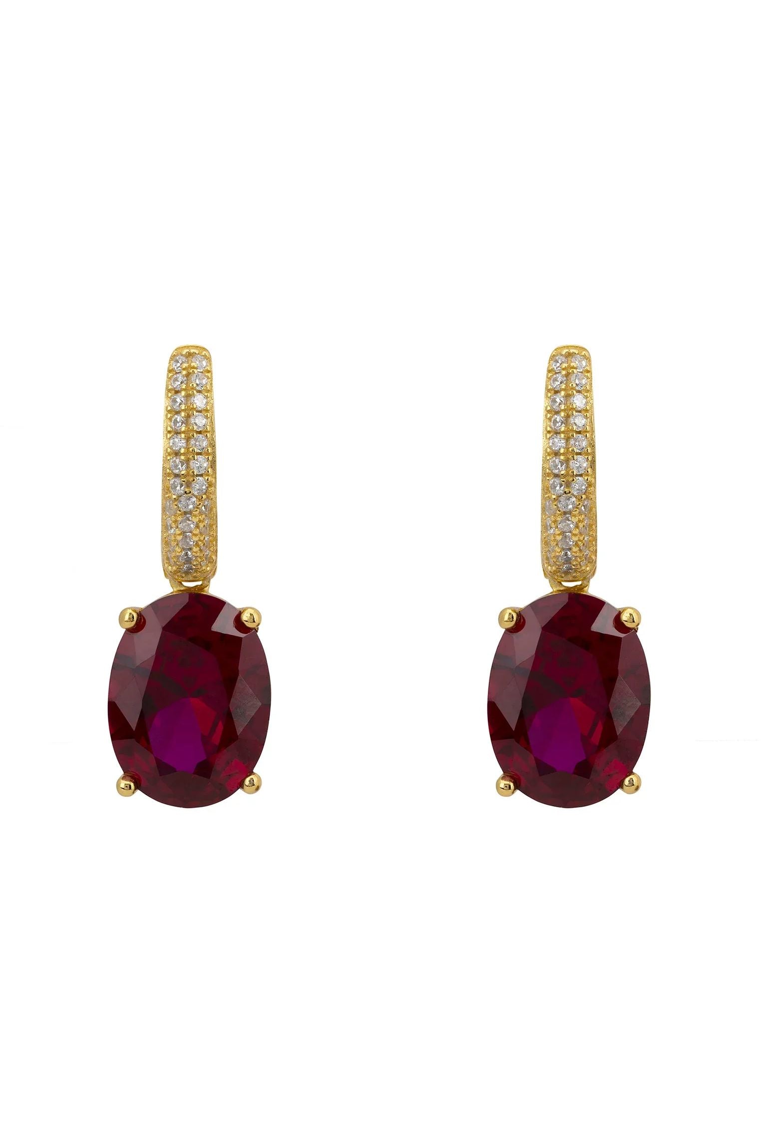 Oval ruby gold earrings.