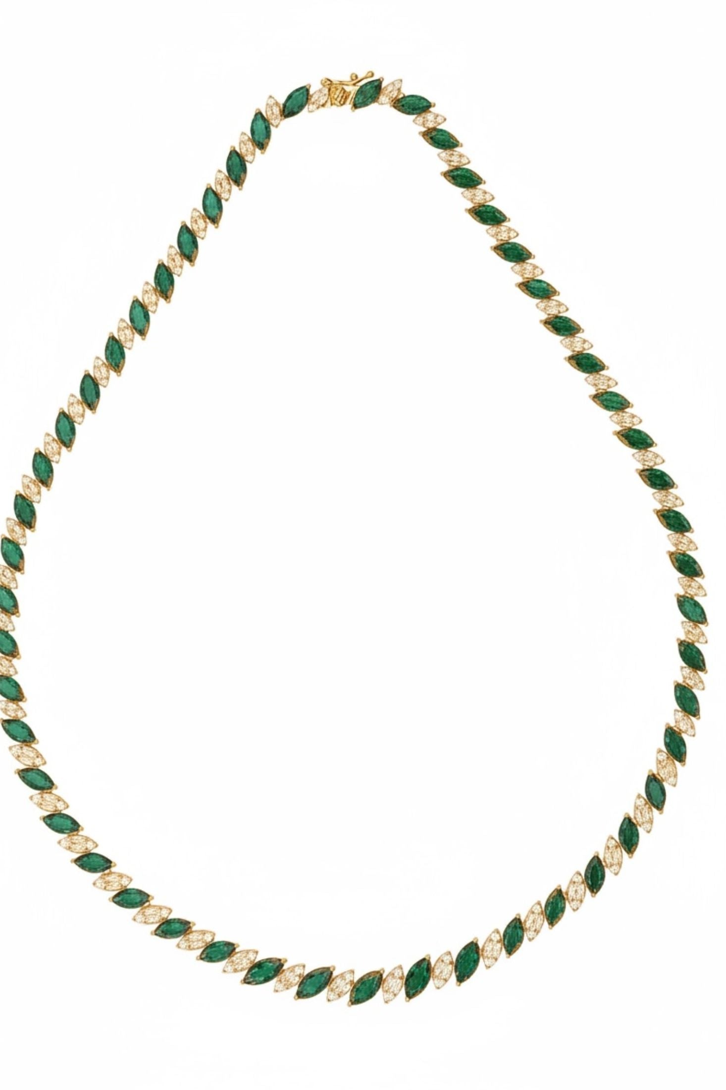 18k gold plated marquise cut tennis necklace with alternating emeralds and simulated diamonds.