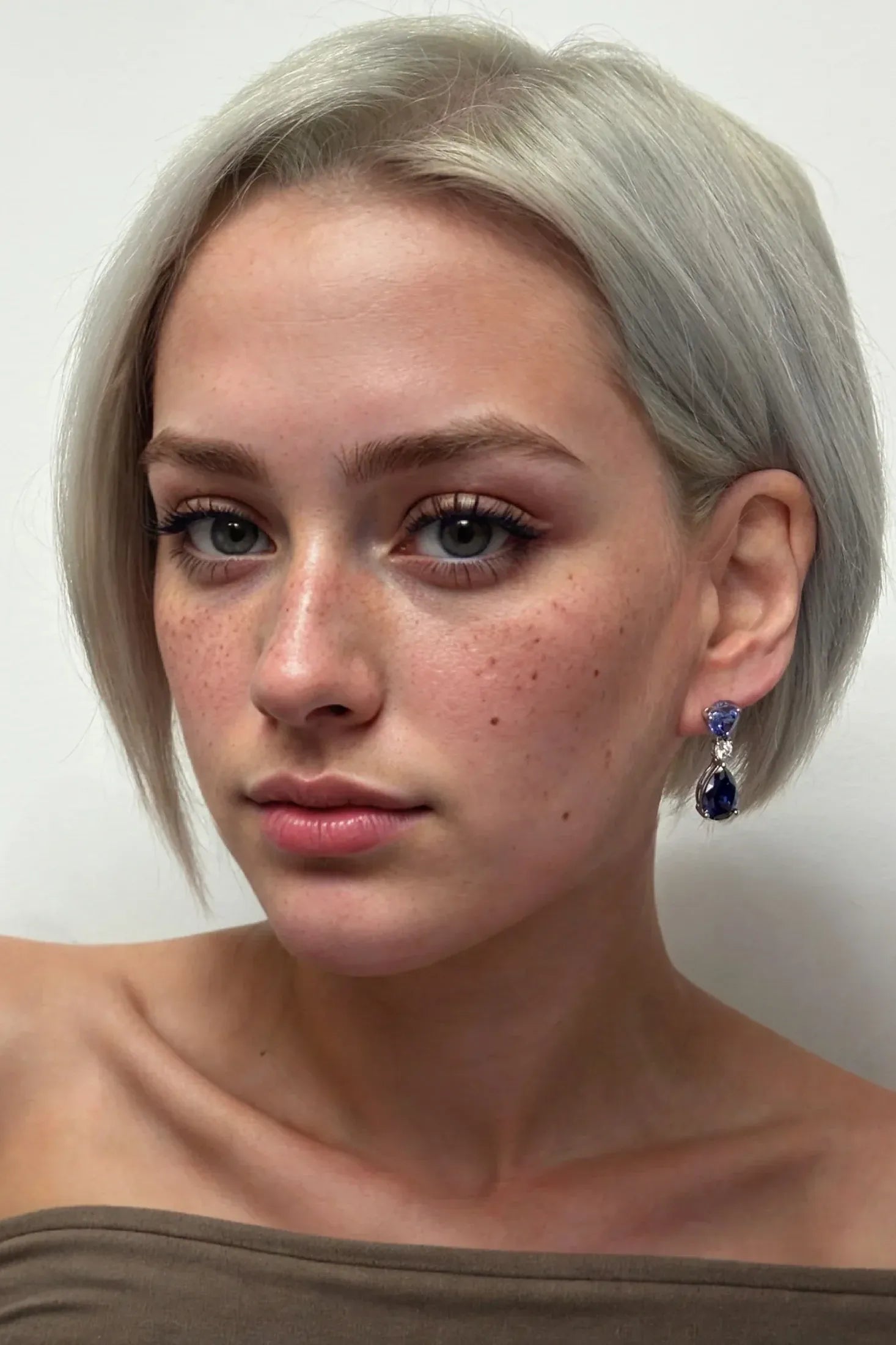 The earring worn by a model.