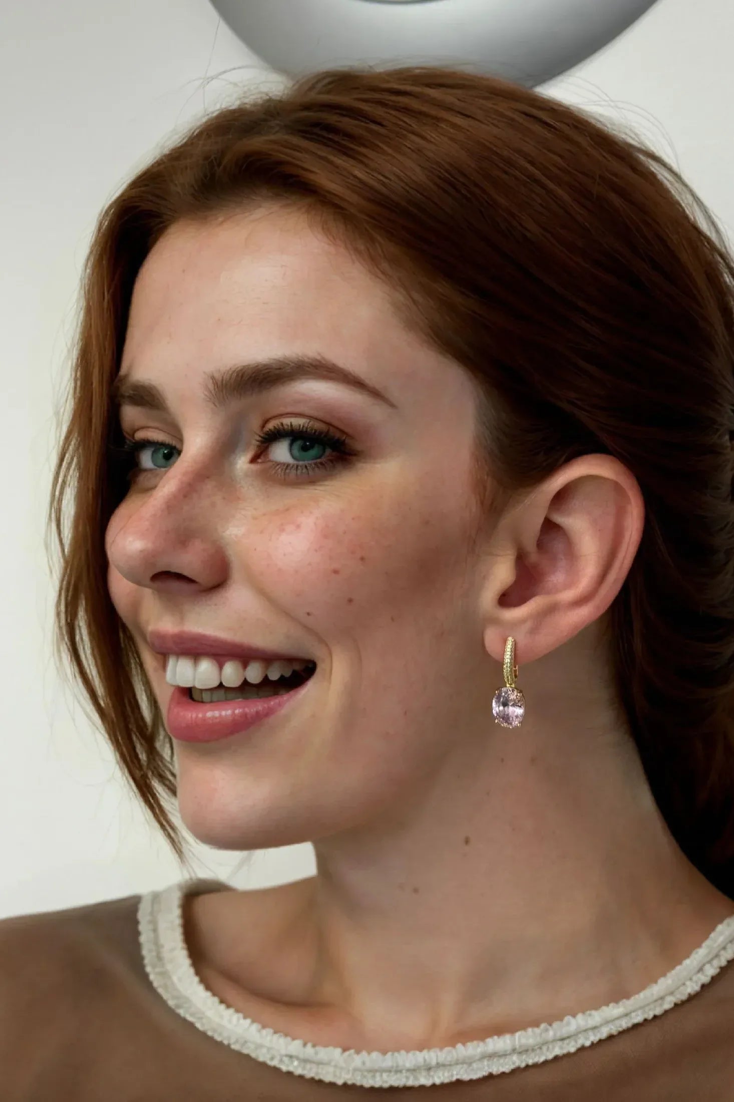 The earring worn by a model.