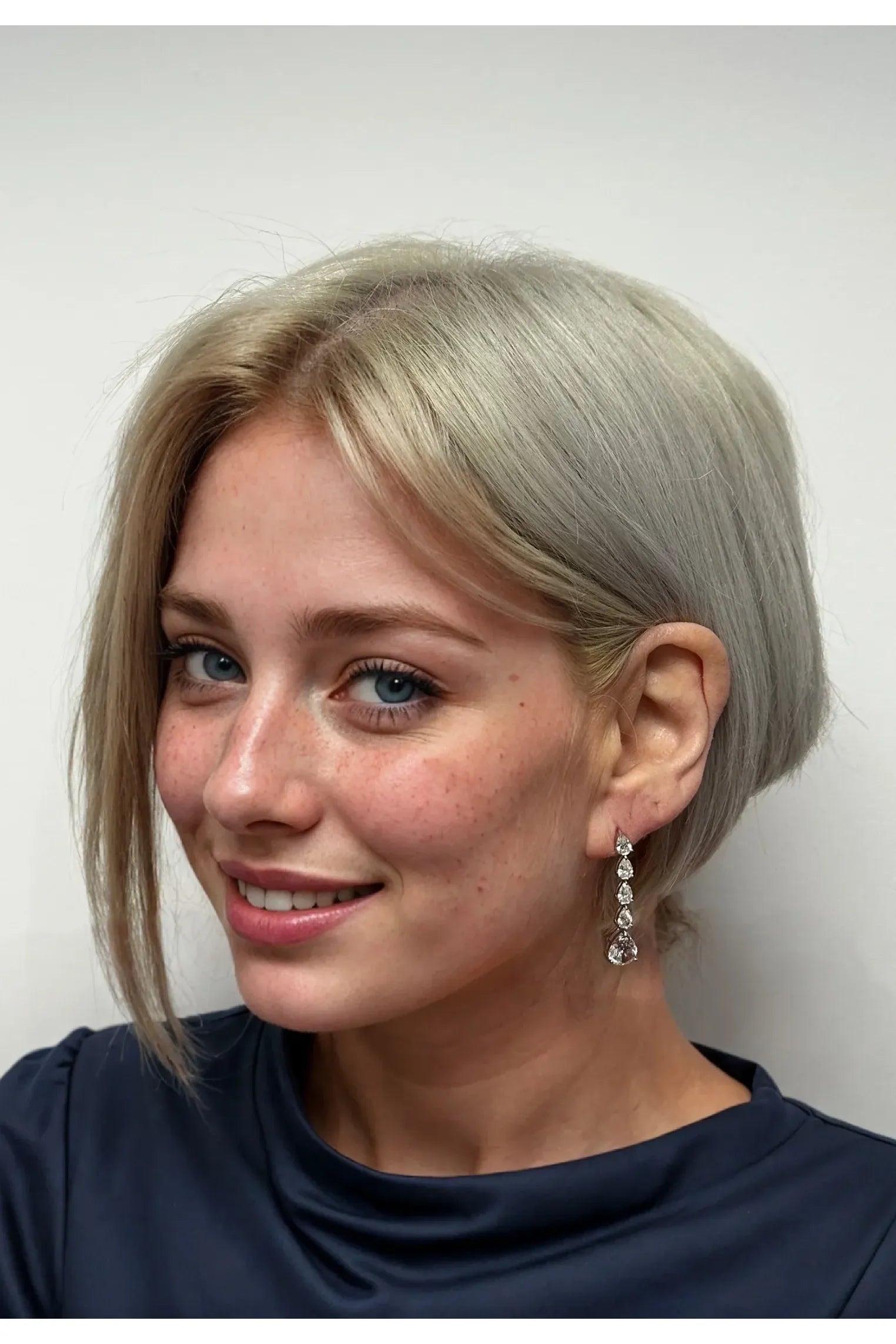 The earring worn by a model.
