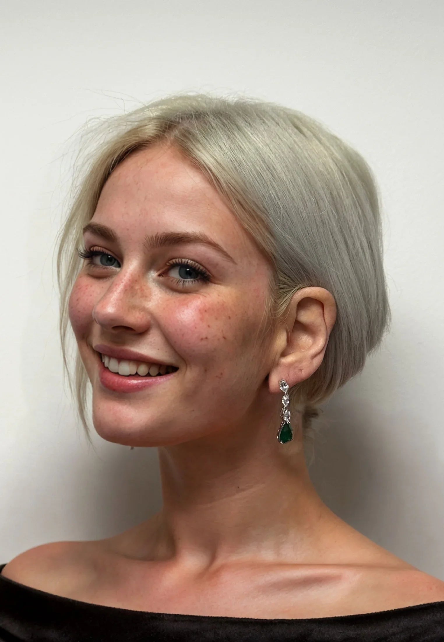 The earring worn by a model.