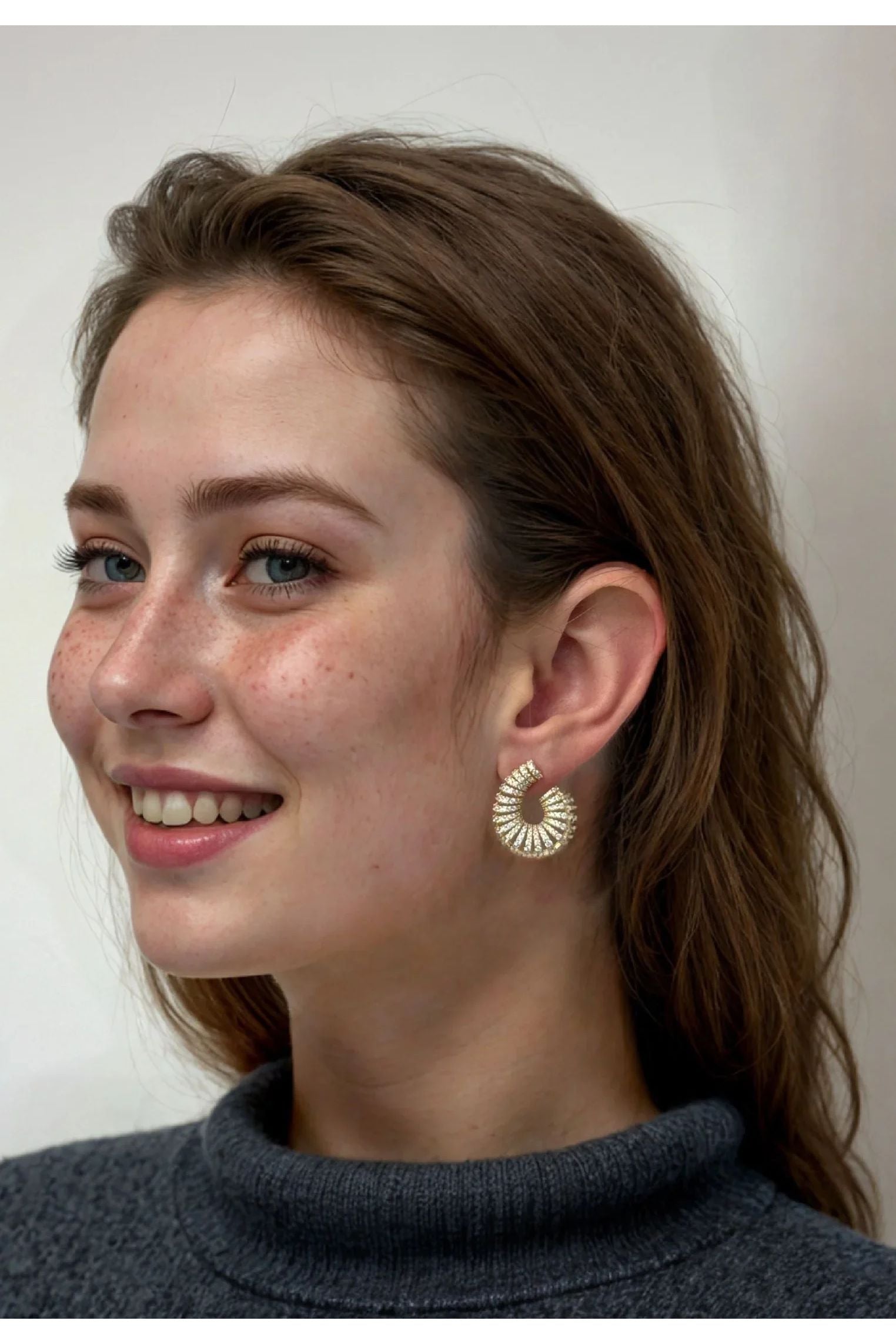 The earring worn by a model.