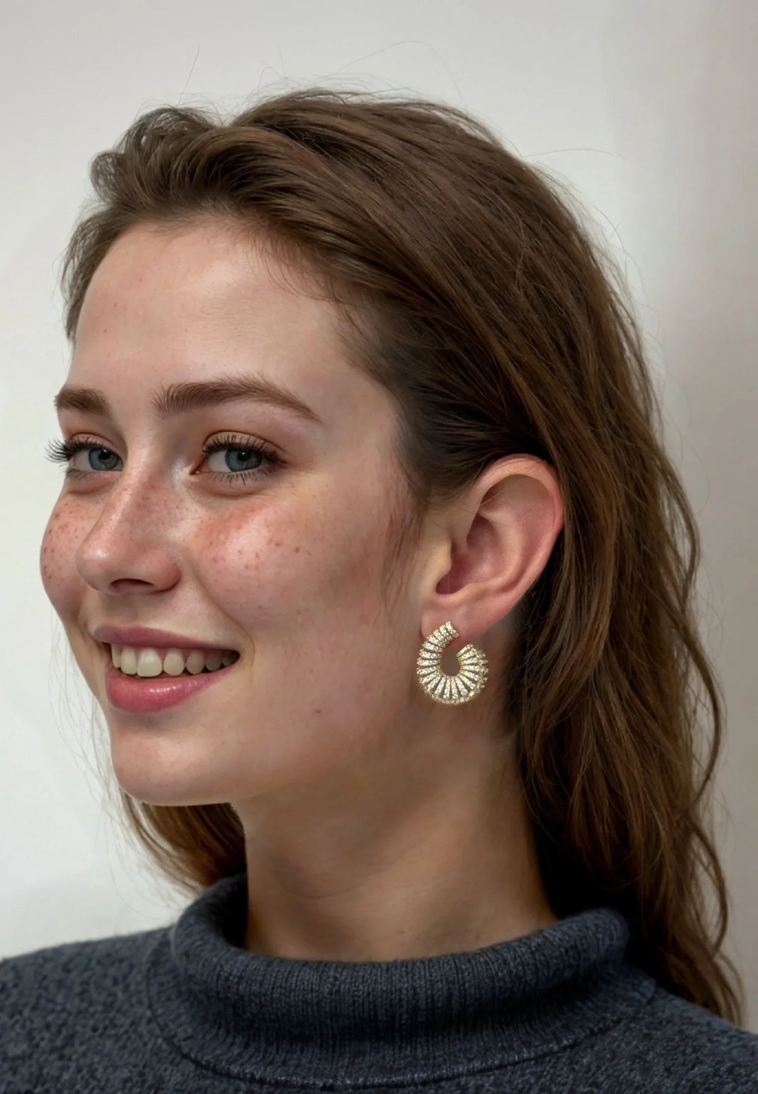 The earring worn by a model.