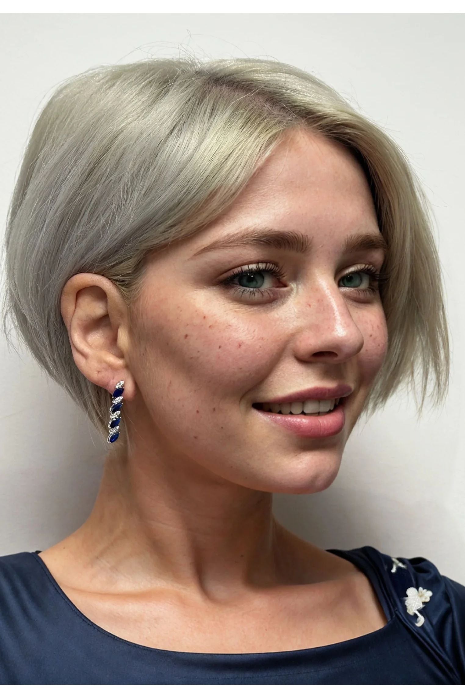 The earring worn by a model.