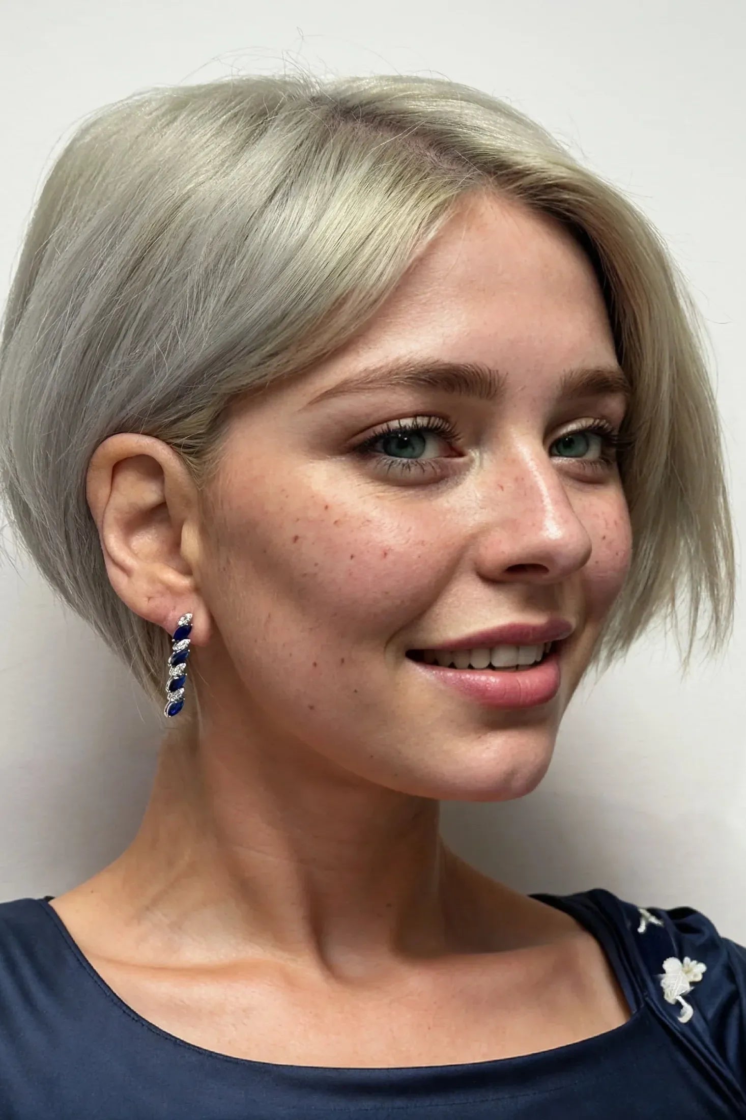 The earring worn by a model.