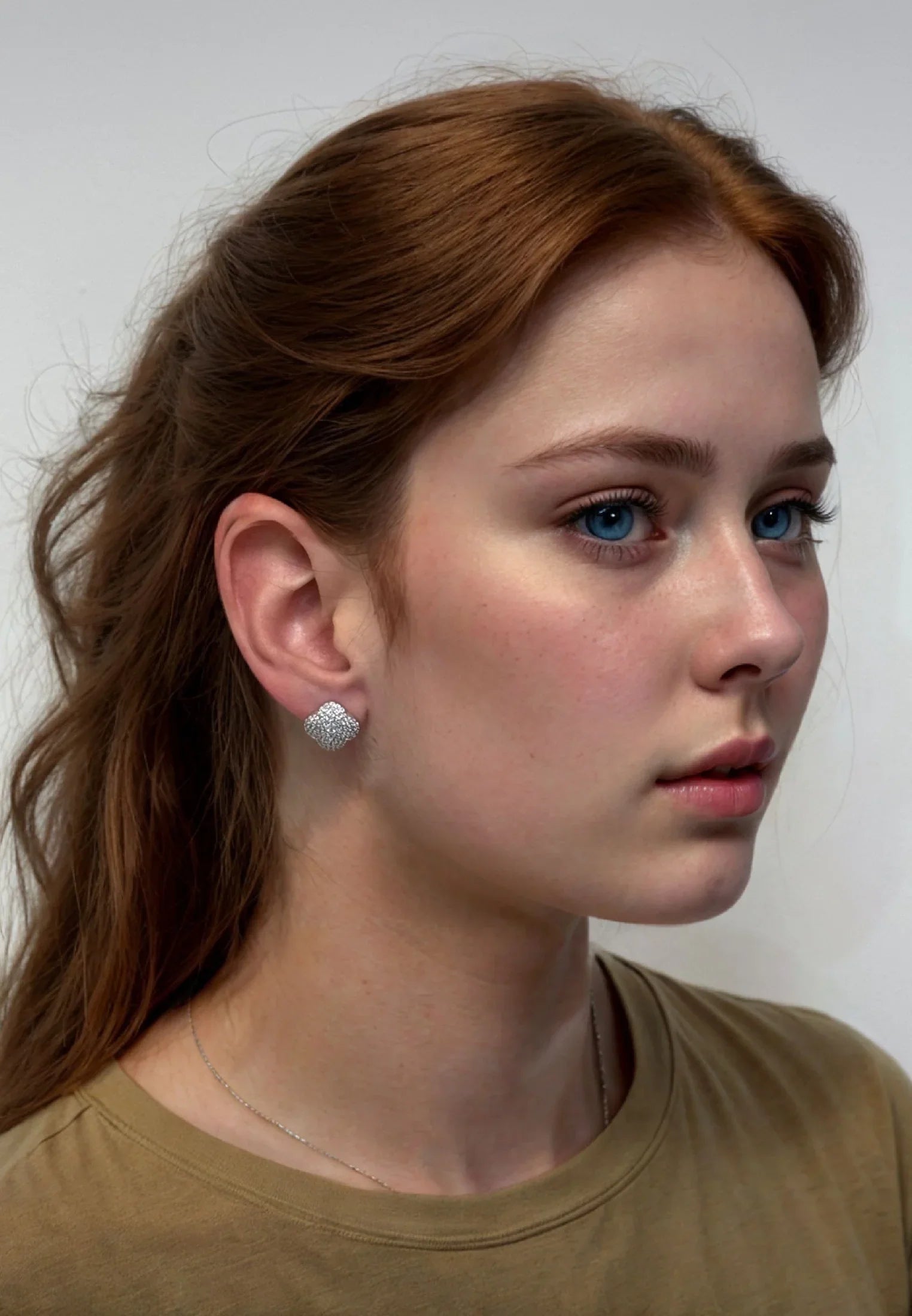 The earring worn by a model.
