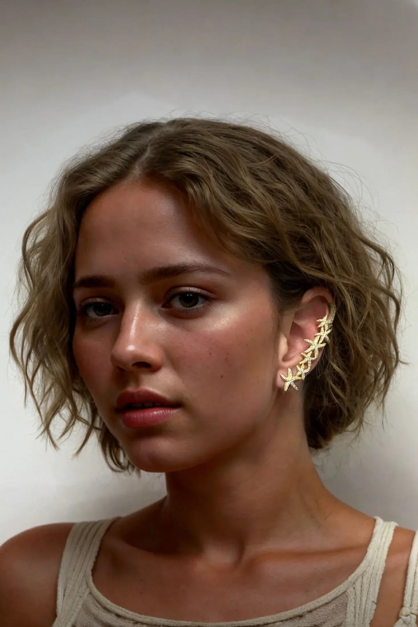The earring worn by a model.