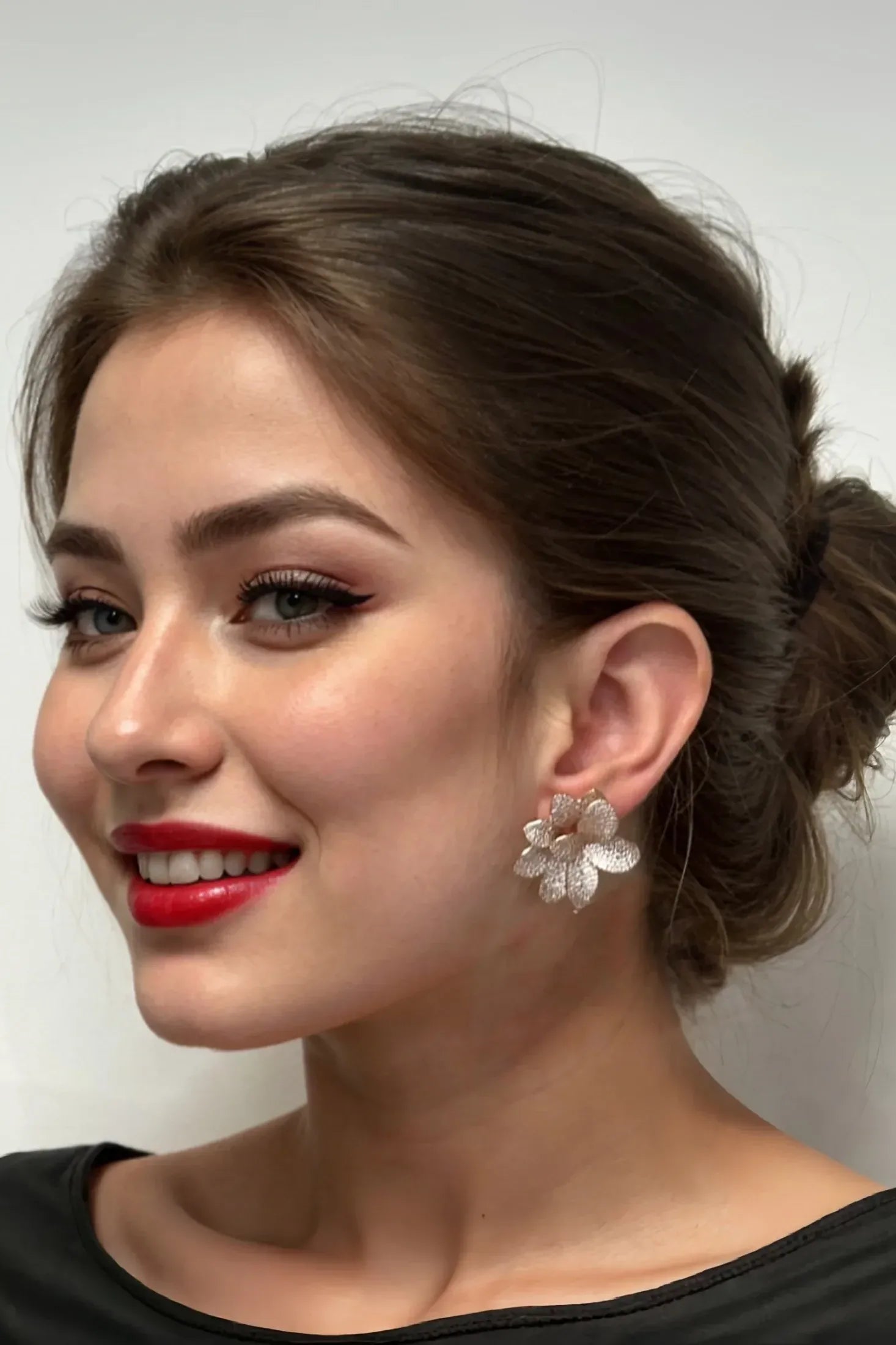 The earring worn by a model.