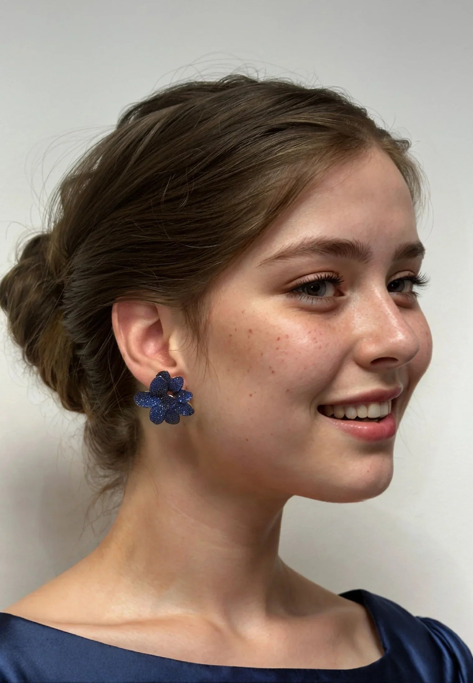The earring worn by a model.