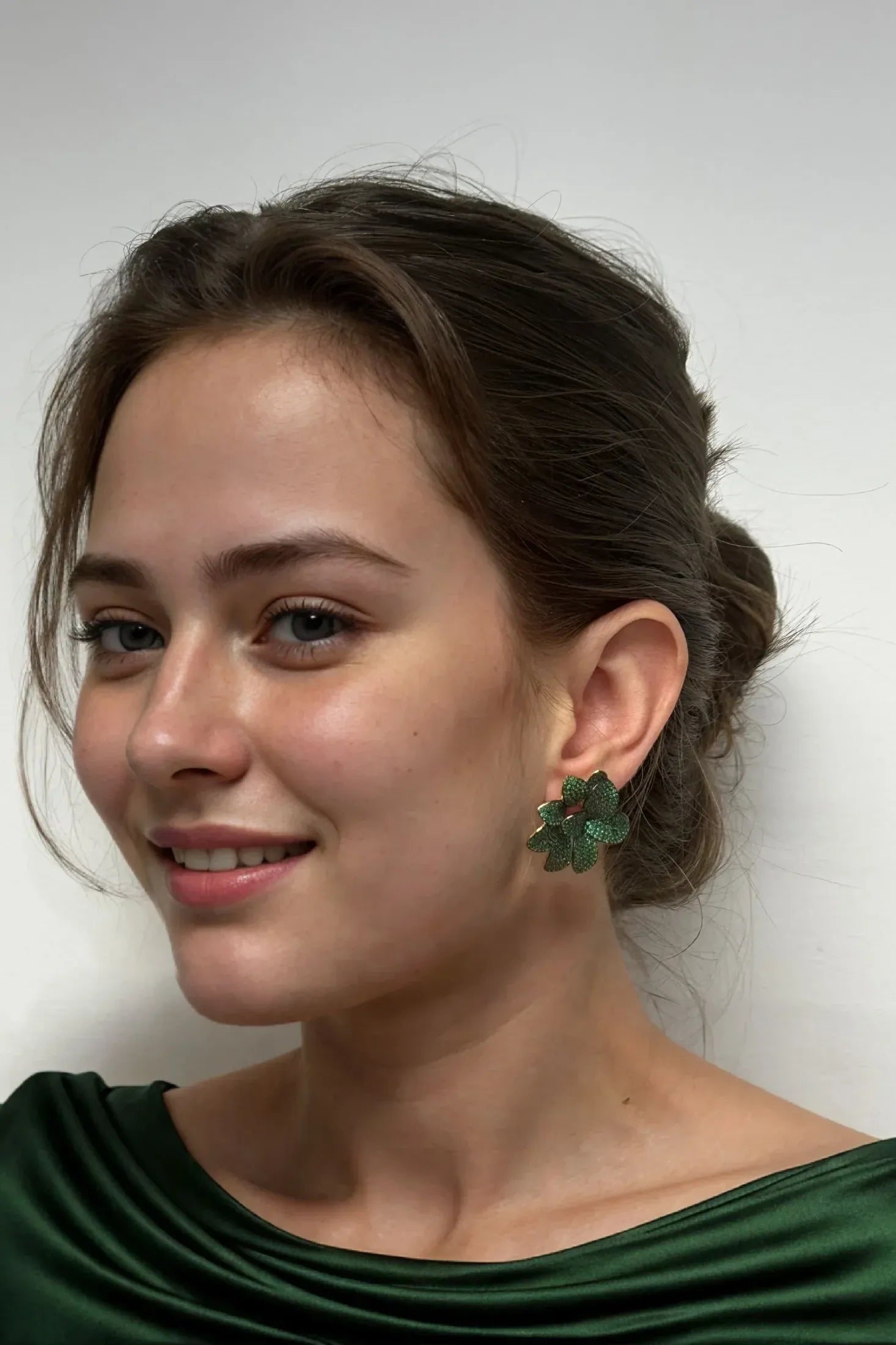 The earring worn by a model.