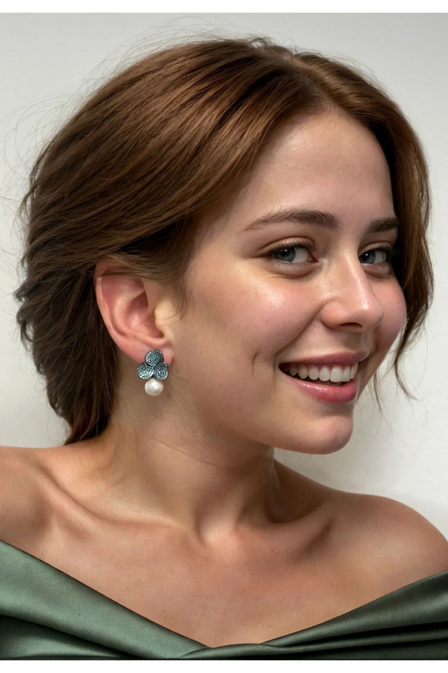 The earring worn by a model.