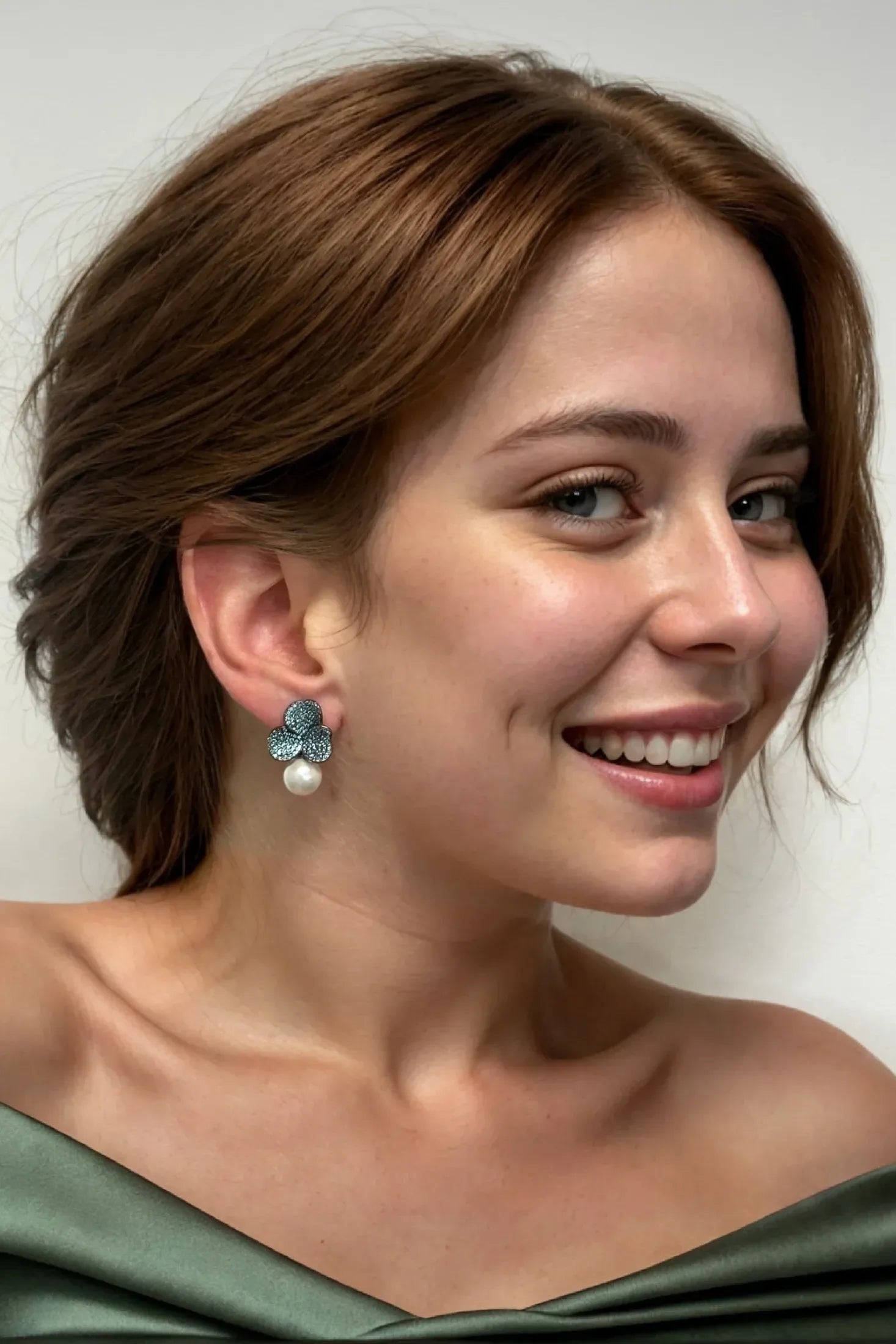 The earring worn by a model.