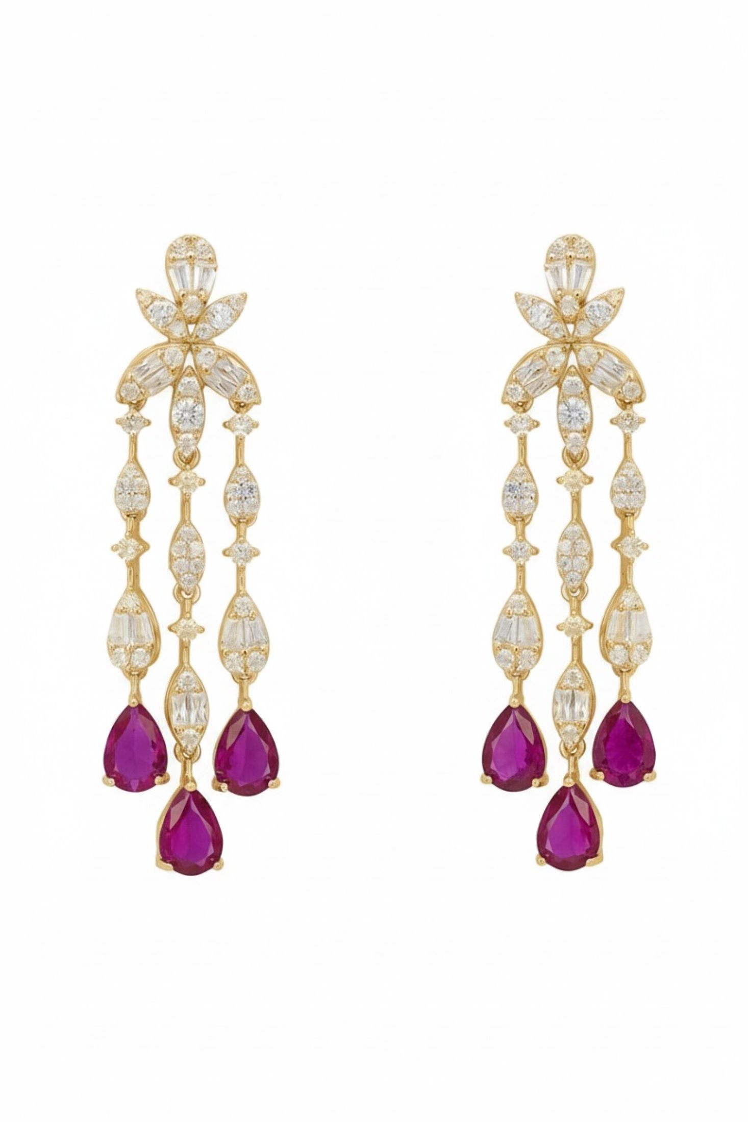 Ruby teardrops, diamond and gold drop earrings.