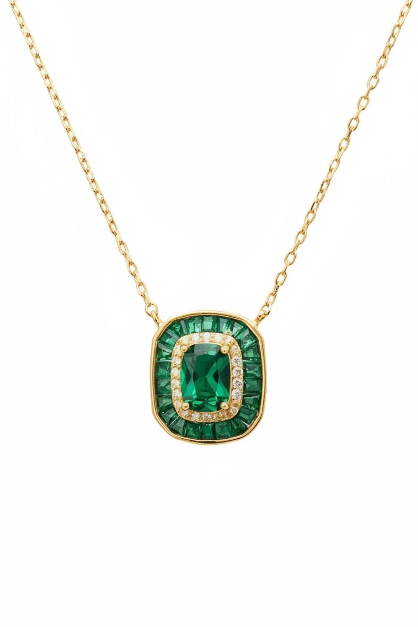 Diamond and emerald charm gold necklace.