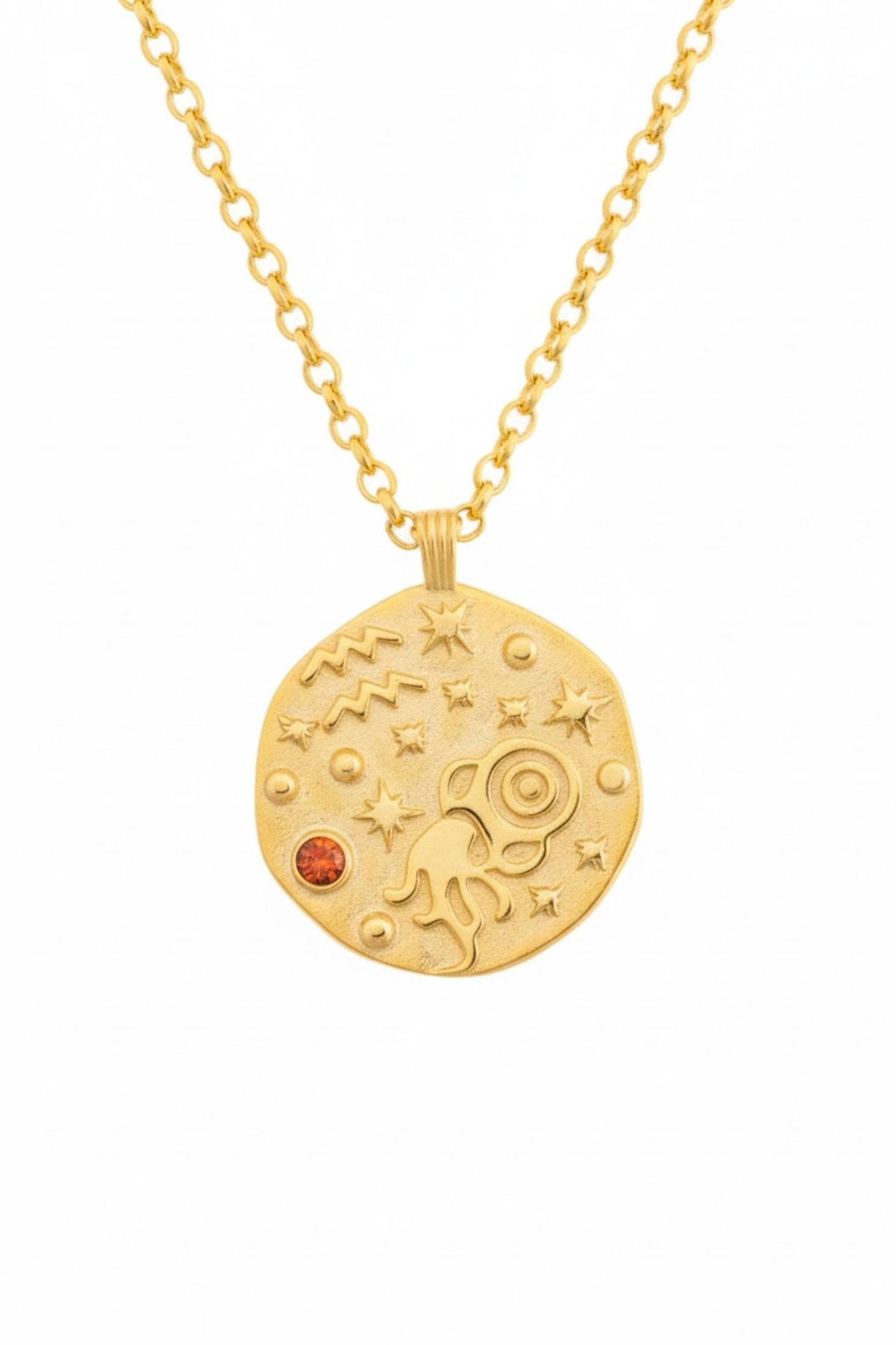 Gold necklace with a celestial pendant on a white background