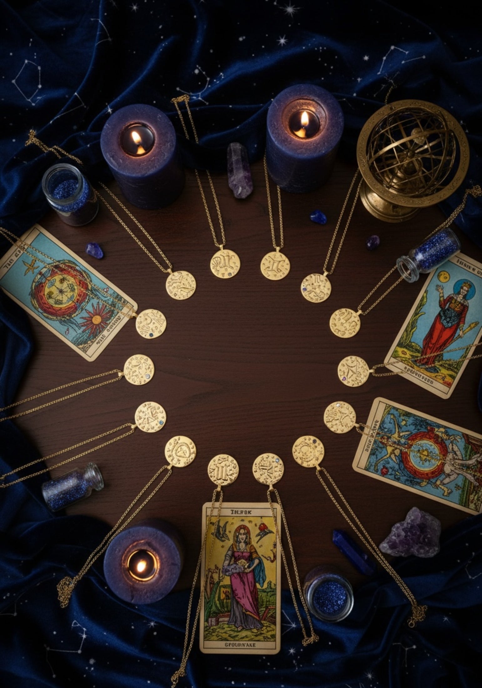 Tarot cards, candles, and gold pendant necklaces arranged in a circle on a dark background