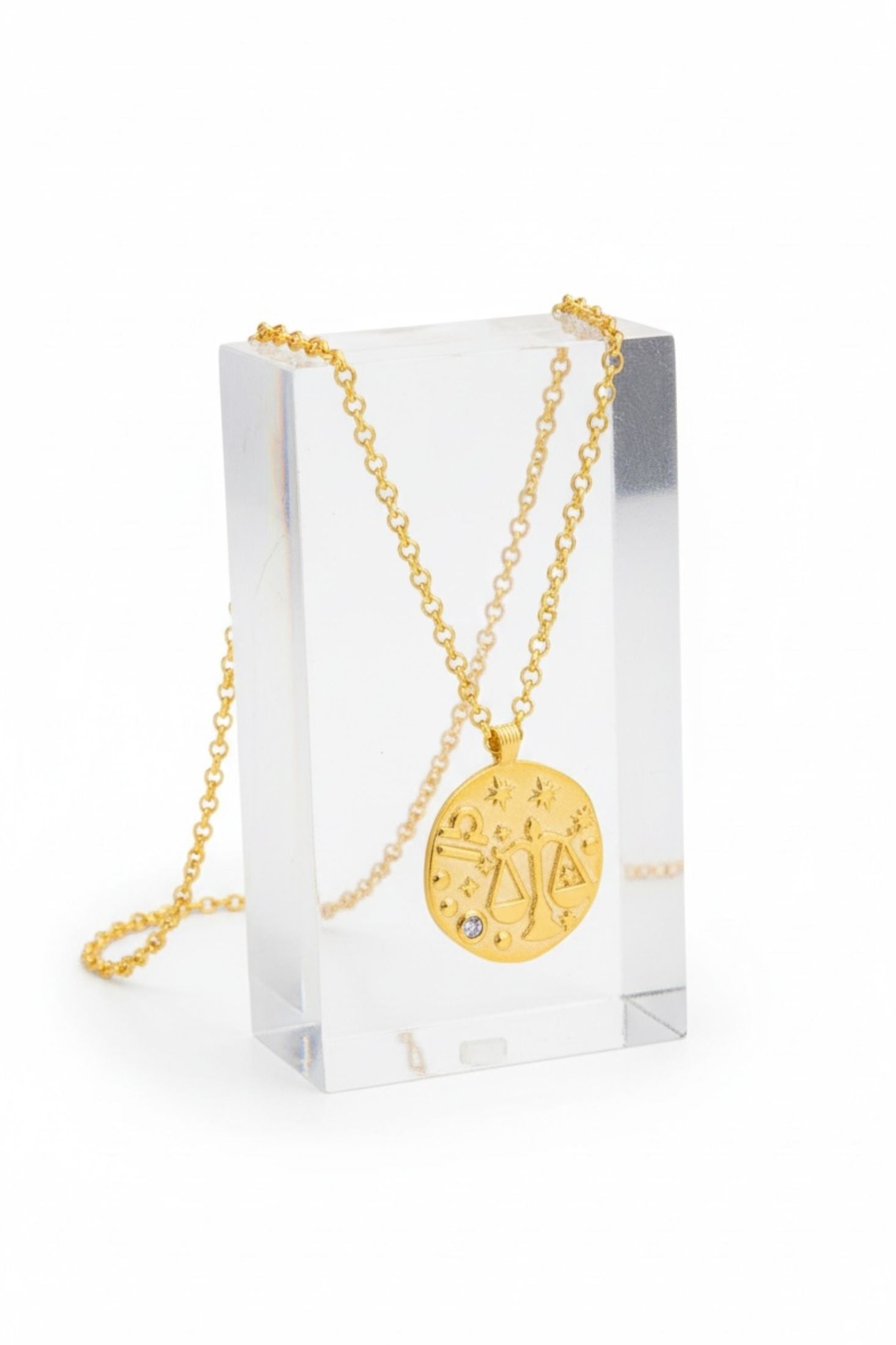 Close-up of Zodiac Birthstone Talisman Necklace Libra Gold, highlighting zodiac design, gold finish.
