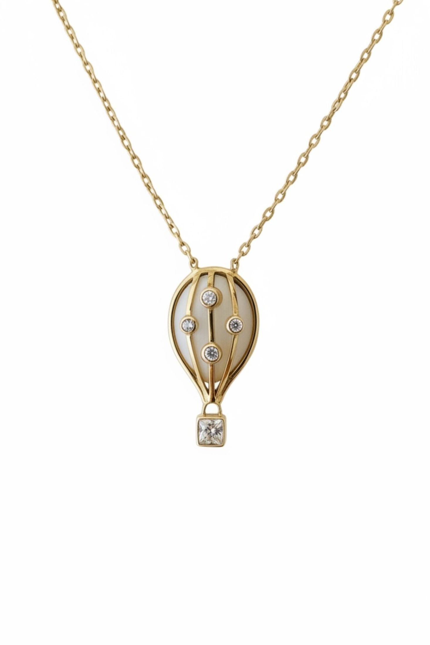 Gold necklace with a hot air balloon pendant on a white background