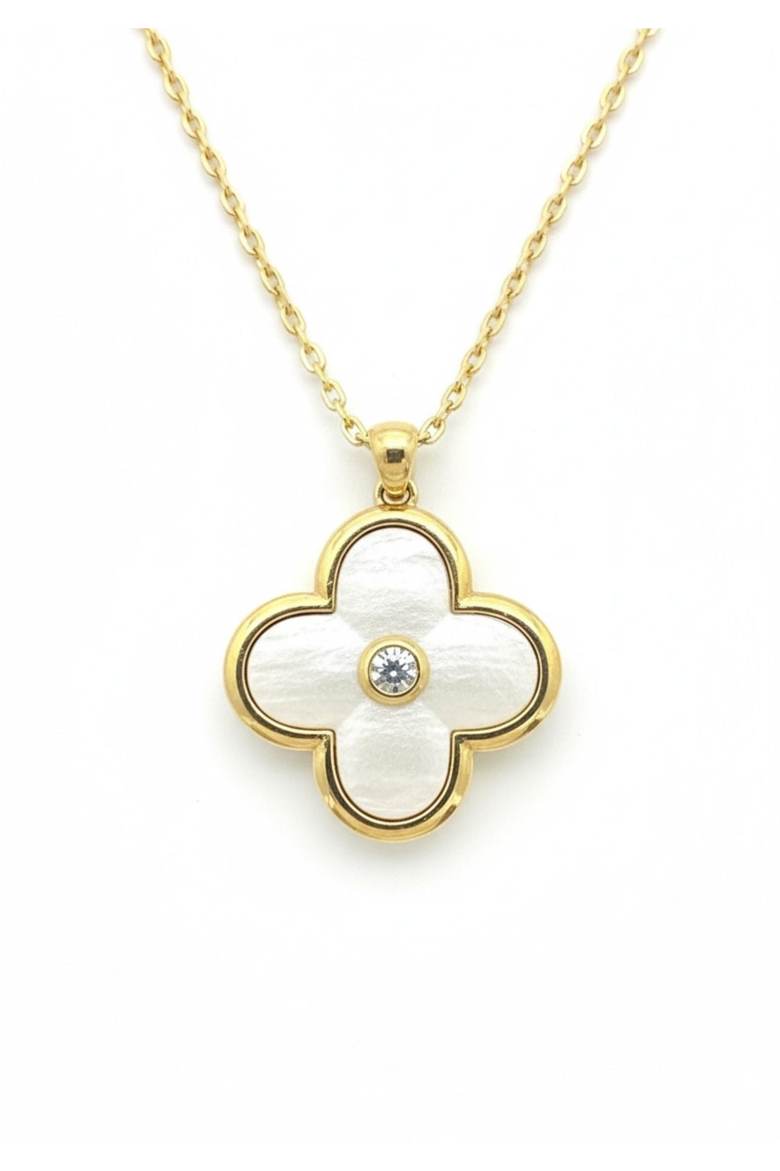 Gold necklace with a clover-shaped pendant on a white background
