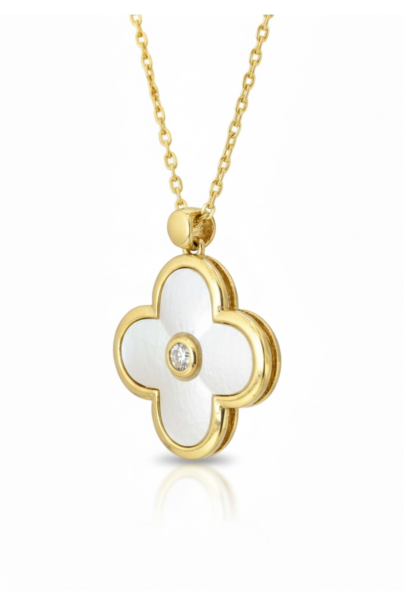 Gold necklace with a white flower-shaped pendant on a white background