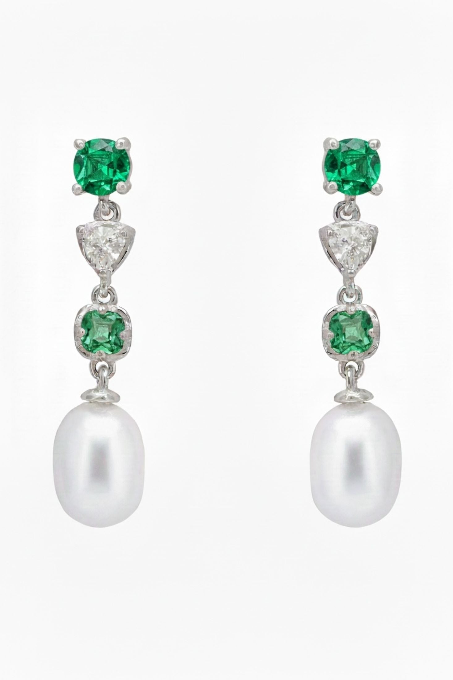 Front view of Pearl Whisper Drop Earrings Emerald Silver, showing cat design, pearl and emerald detailing, silver finish.