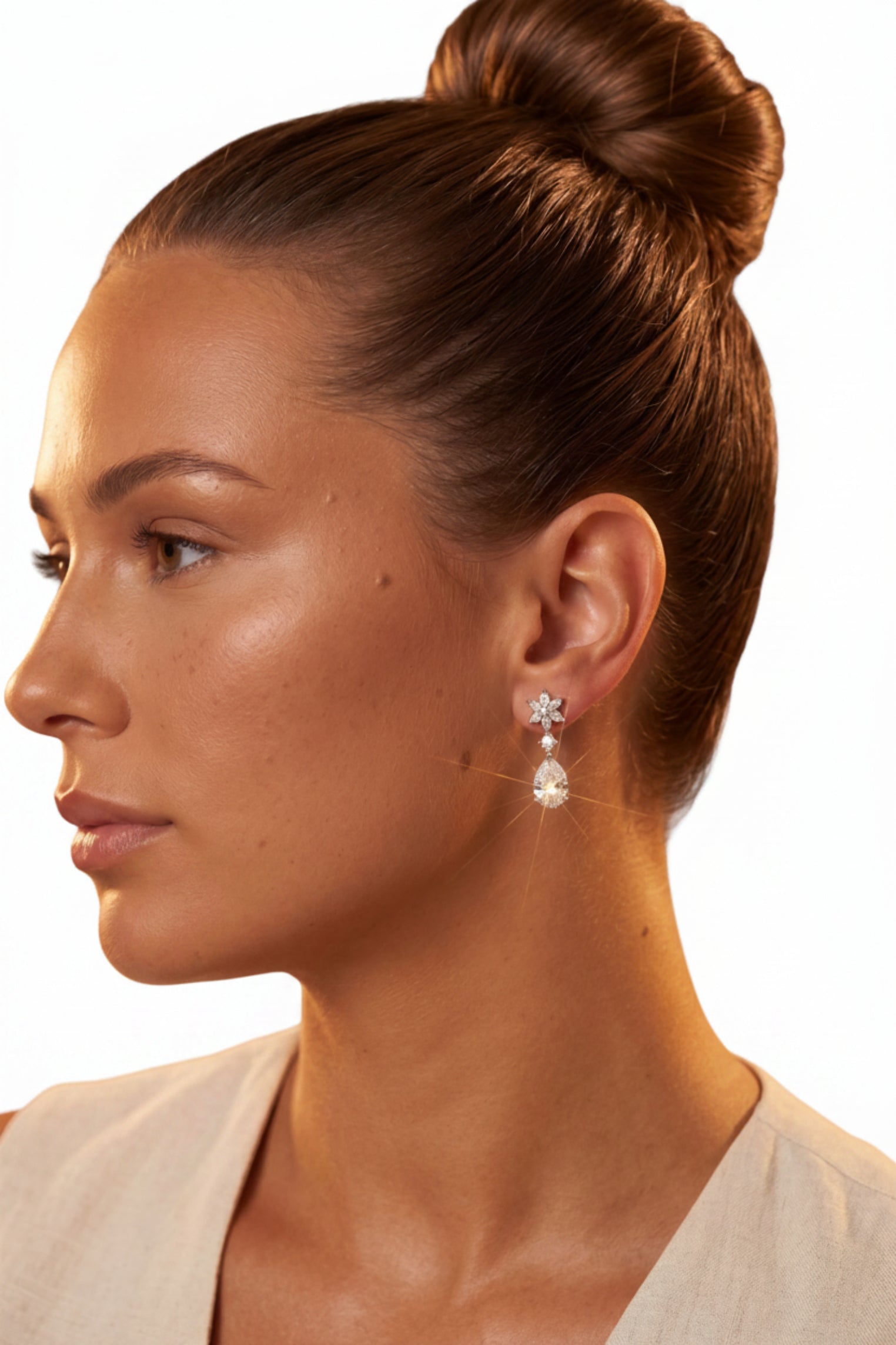 Angled view of Sunflower Moissanite Drop Earrings Silver, showing flower design, silver finish and the jewellery profile.