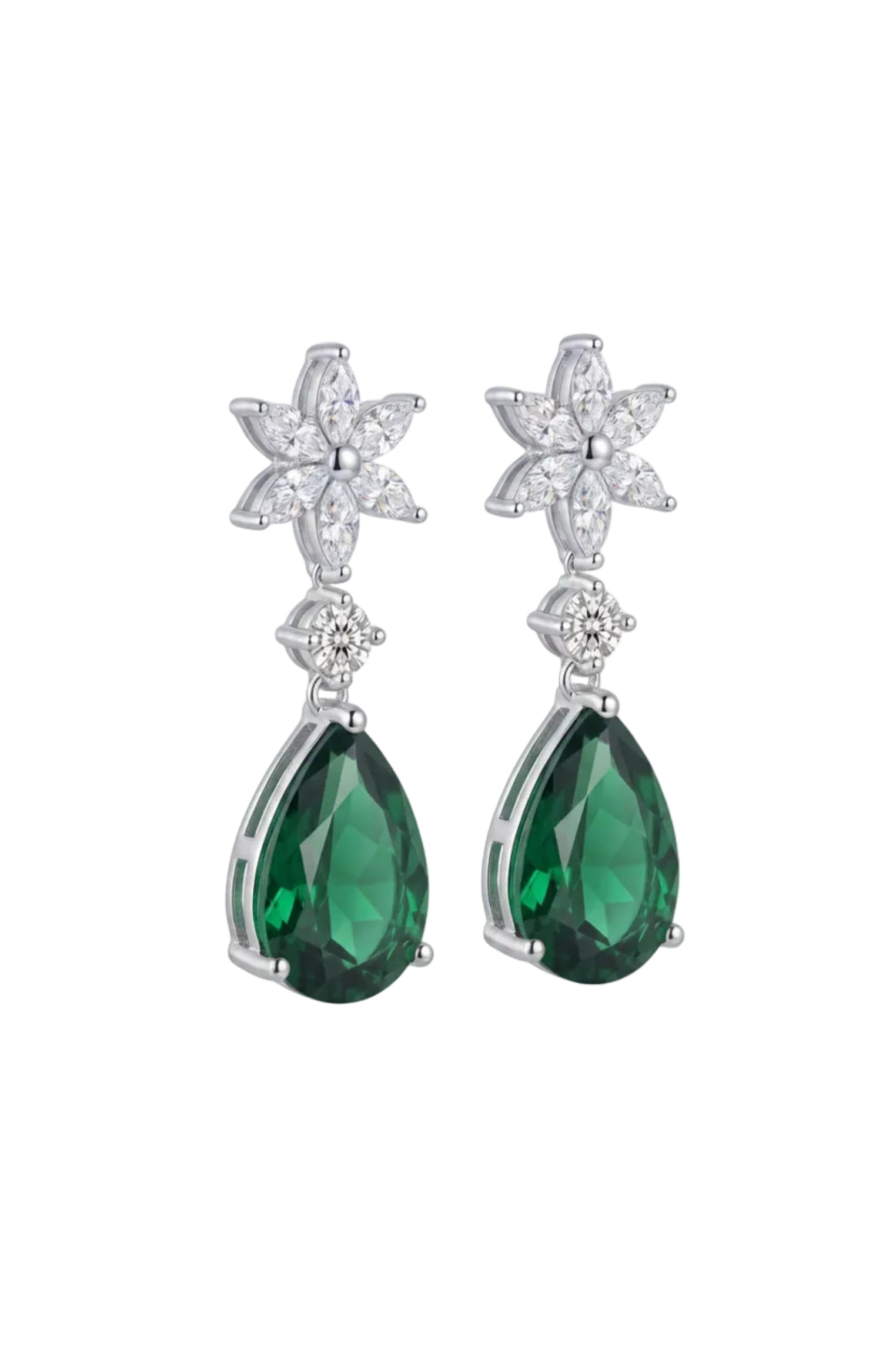 A pair of silver drop earrings featuring teardrop-shaped green emerald-cut gemstones and starburst floral clusters set with small clear stones, shown against a plain white background.