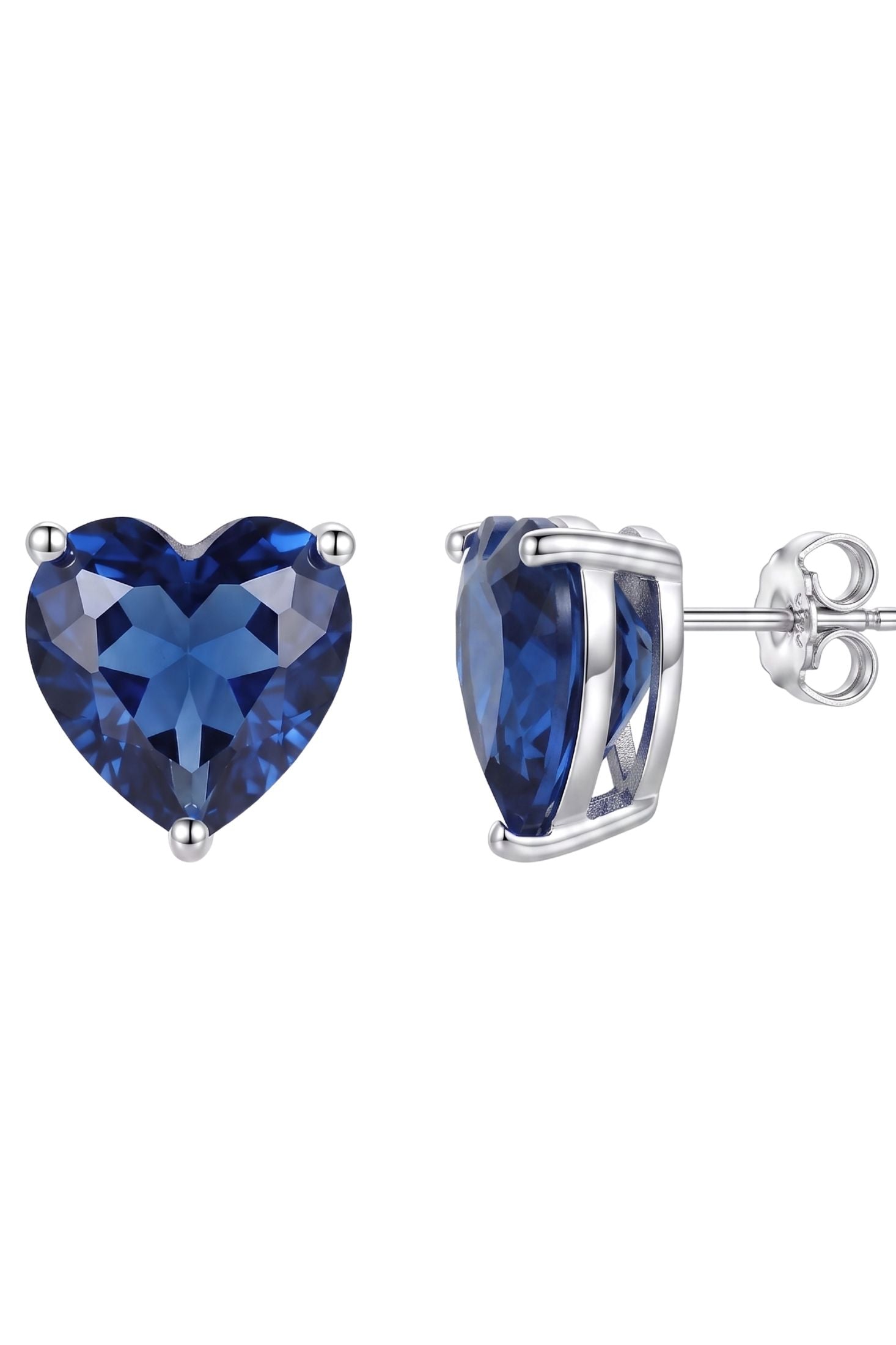 Angled view of Amore Heart Sapphire Stud Earrings Silver, showing heart design, sapphire detailing, silver finish and the jewellery profile.