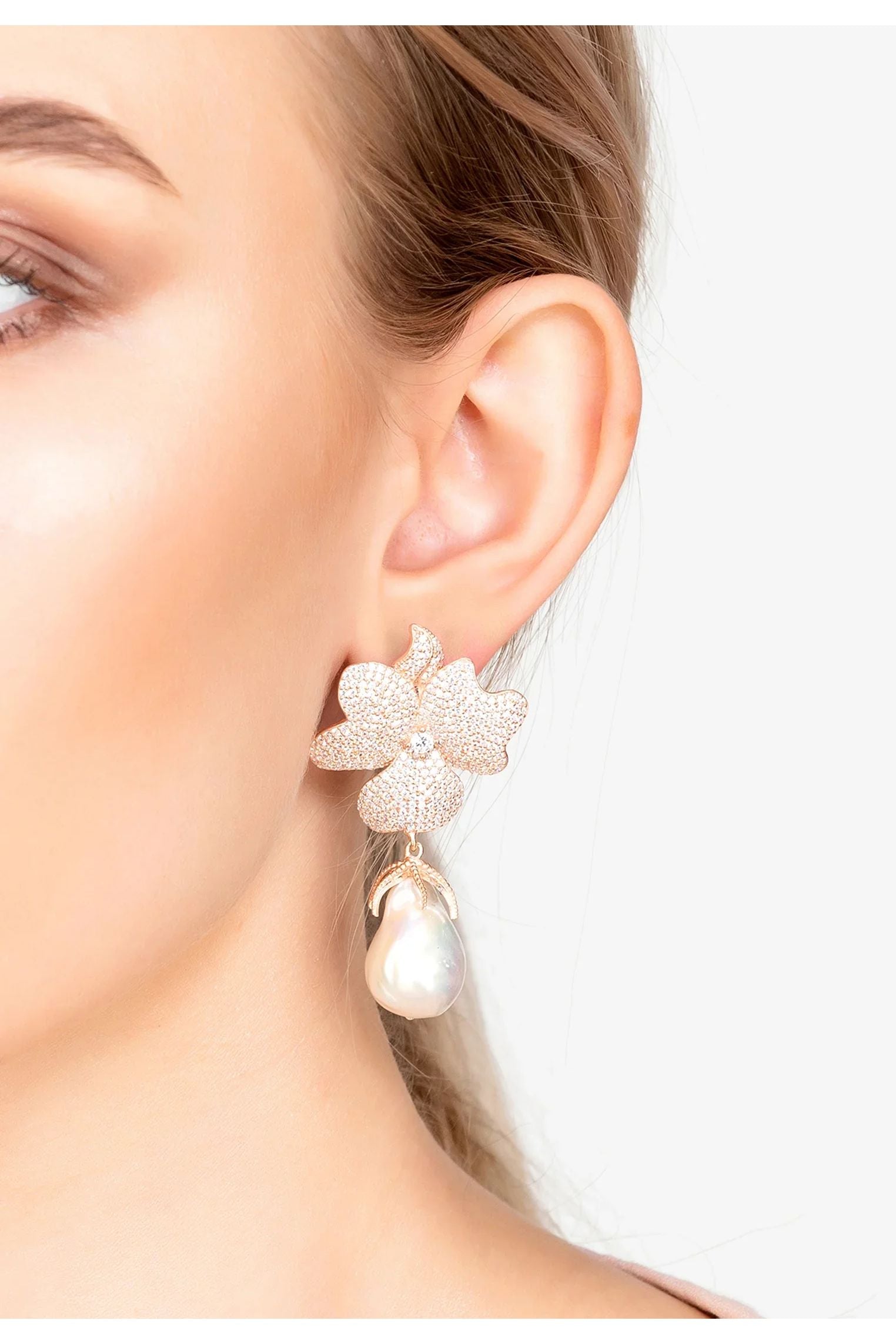 The earring worn by a model.