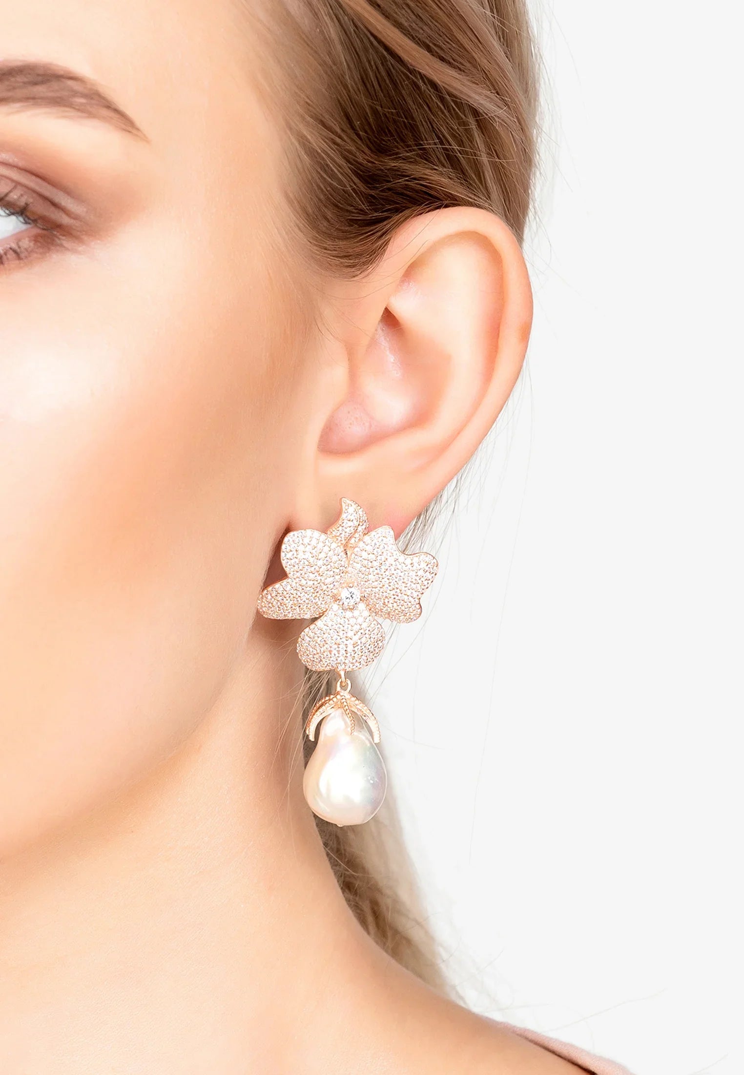 The earring worn by a model.