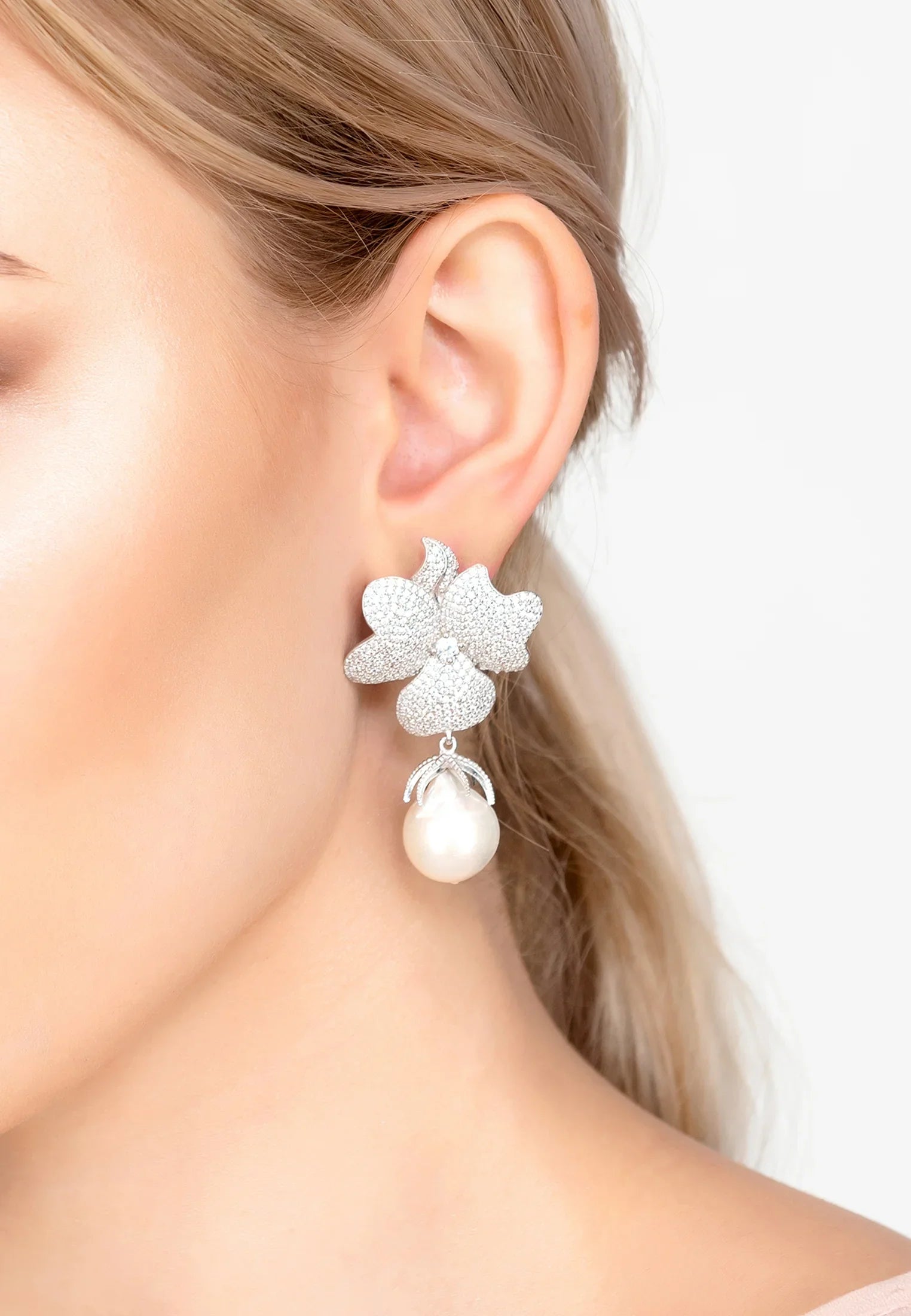 The earring worn by a model.