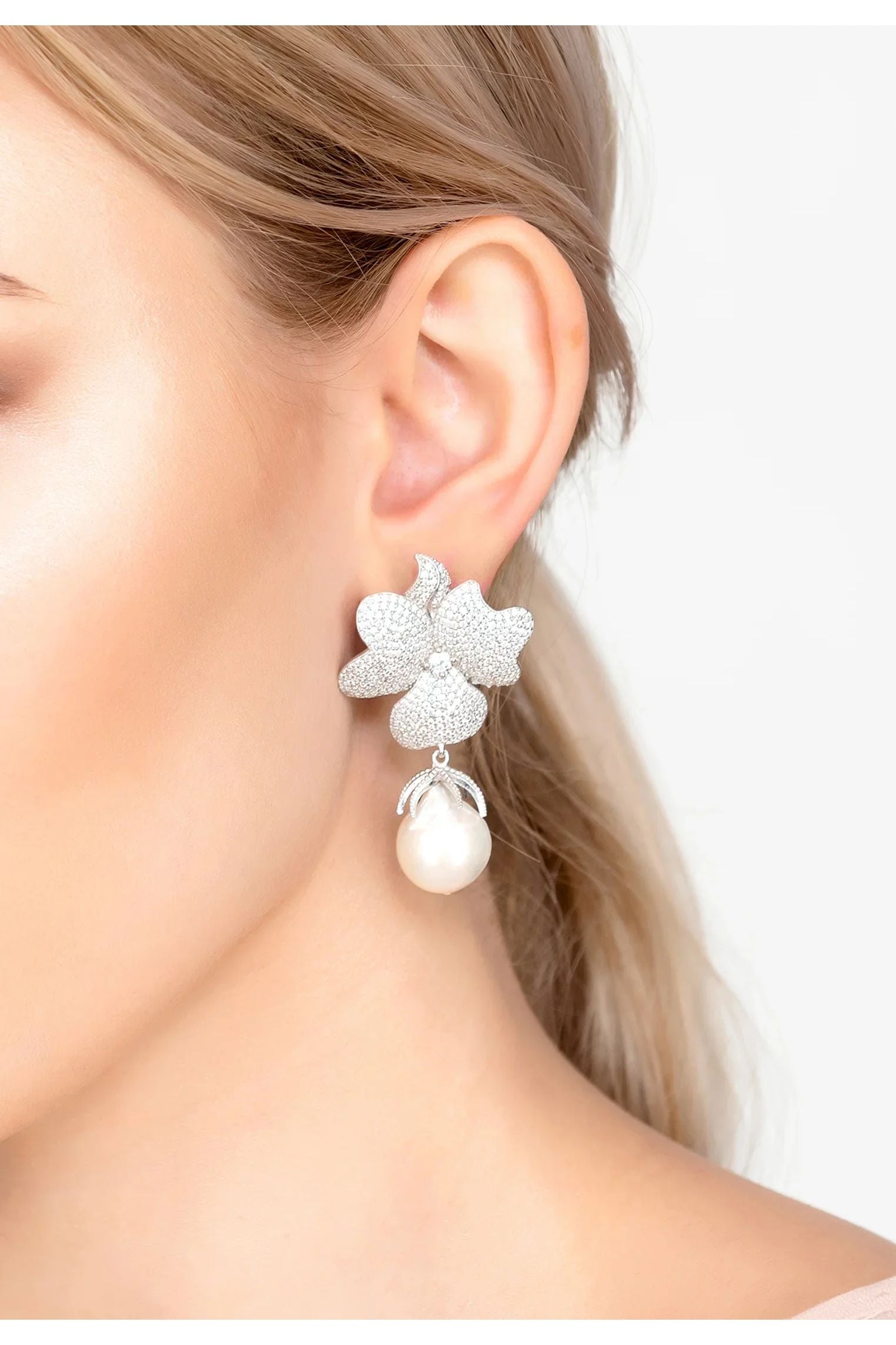 The earring worn by a model.