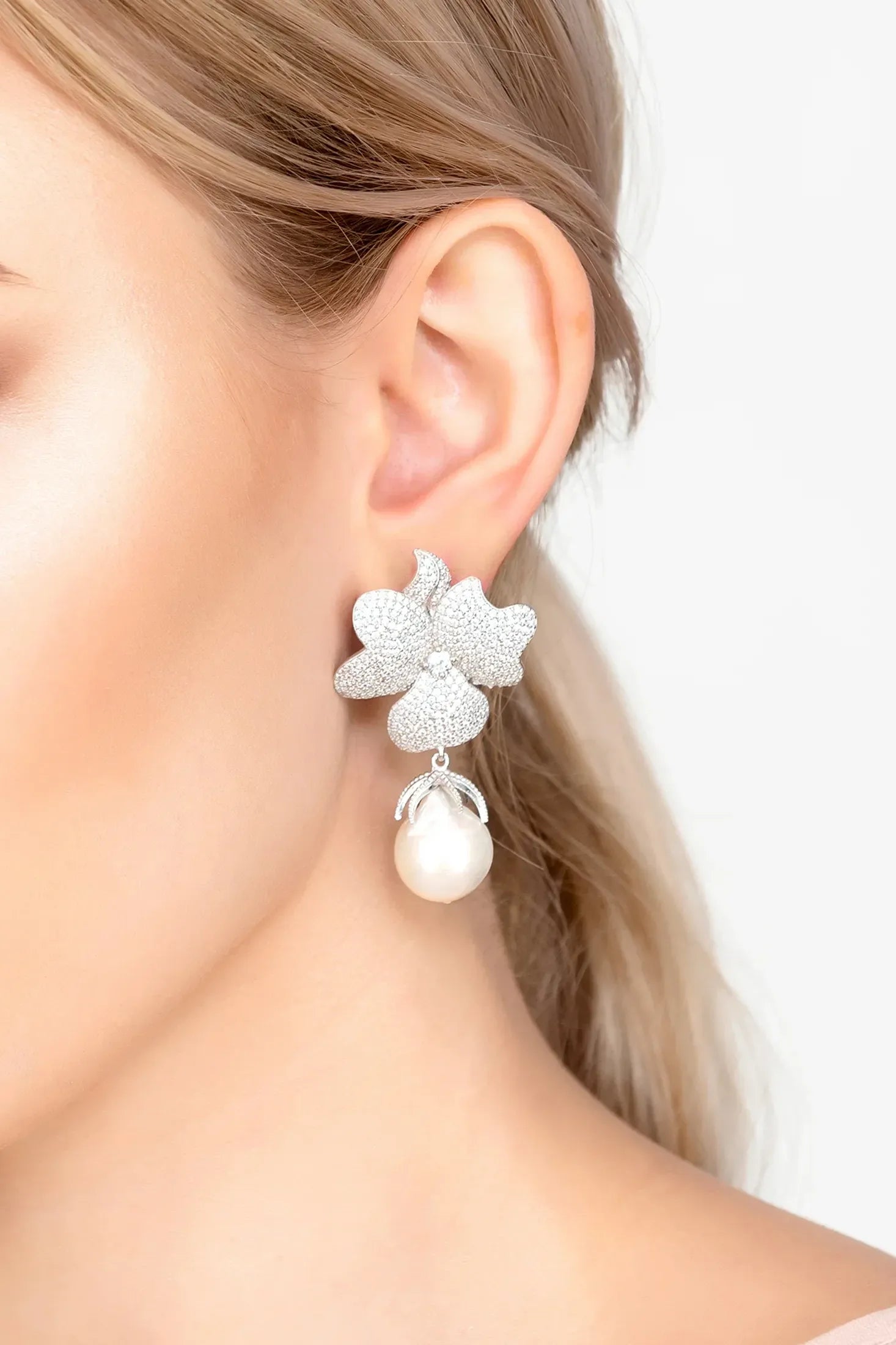 The earring worn by a model.