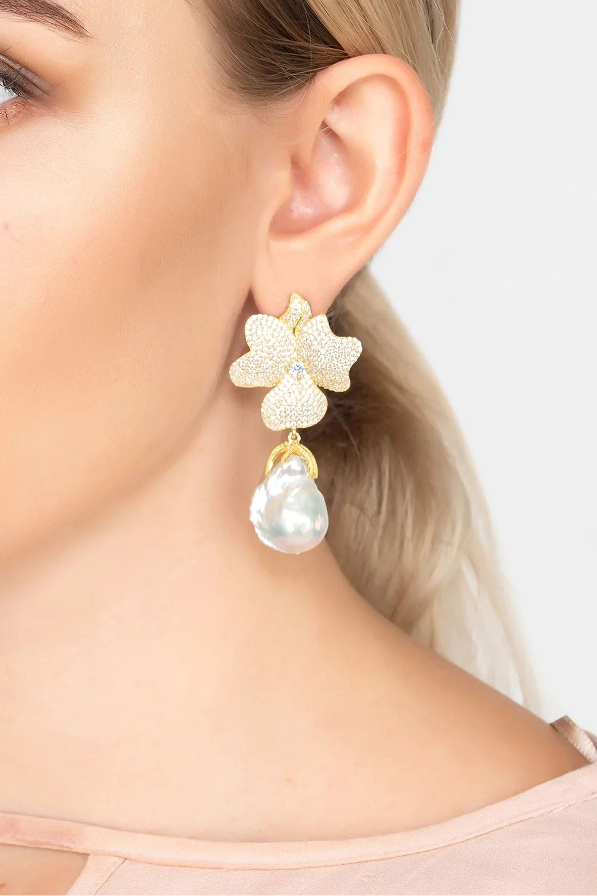 The earring worn by a model.