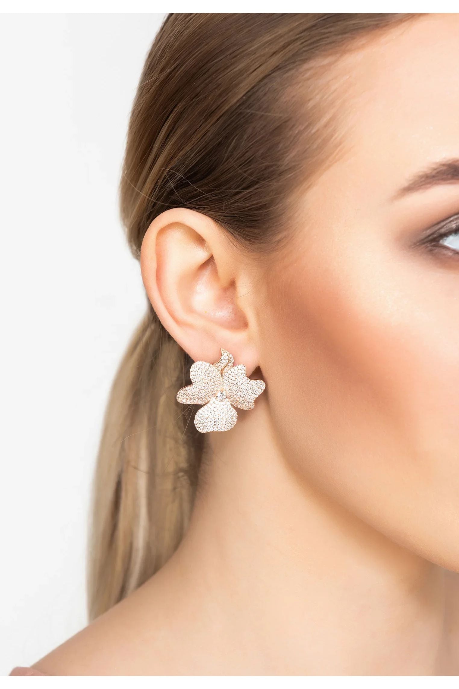 The earring worn by a model.