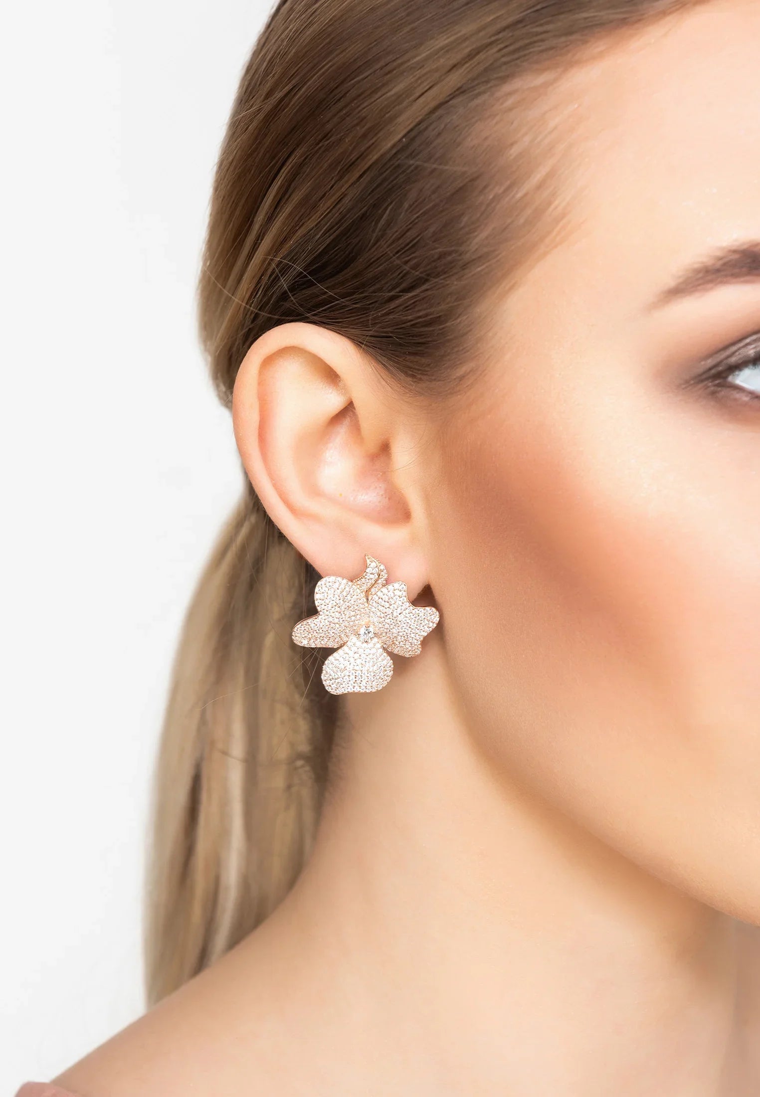The earring worn by a model.