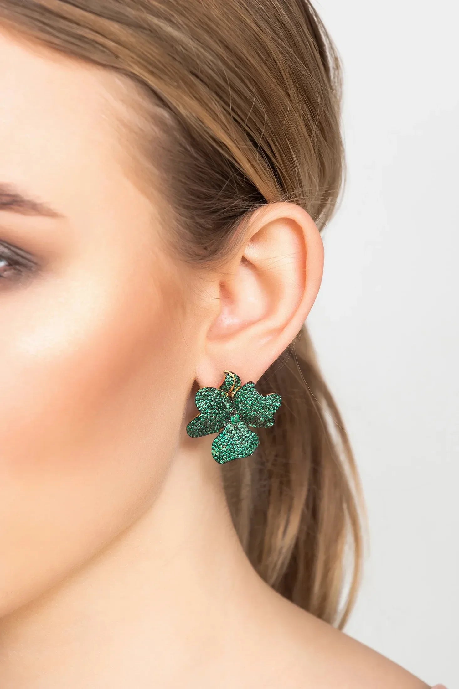 The earring worn by a model.