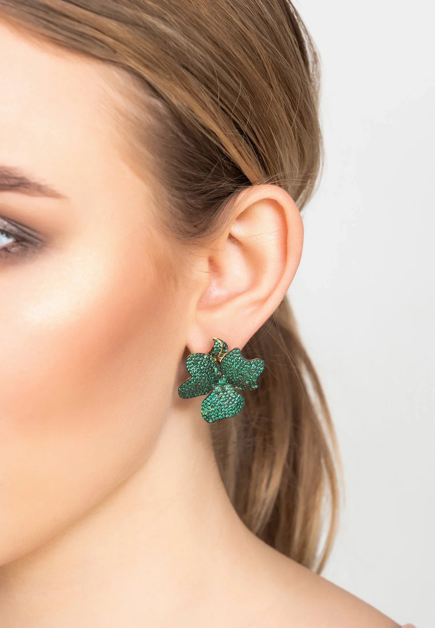 The earring worn by a model.