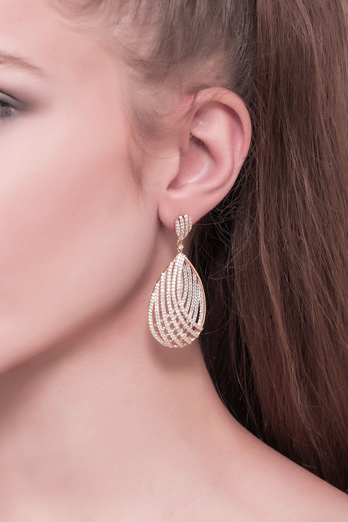 The earring worn by a model.