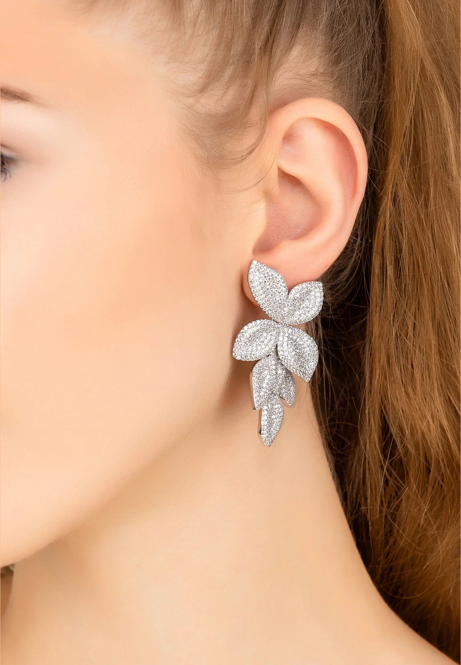 The earring worn by a model.