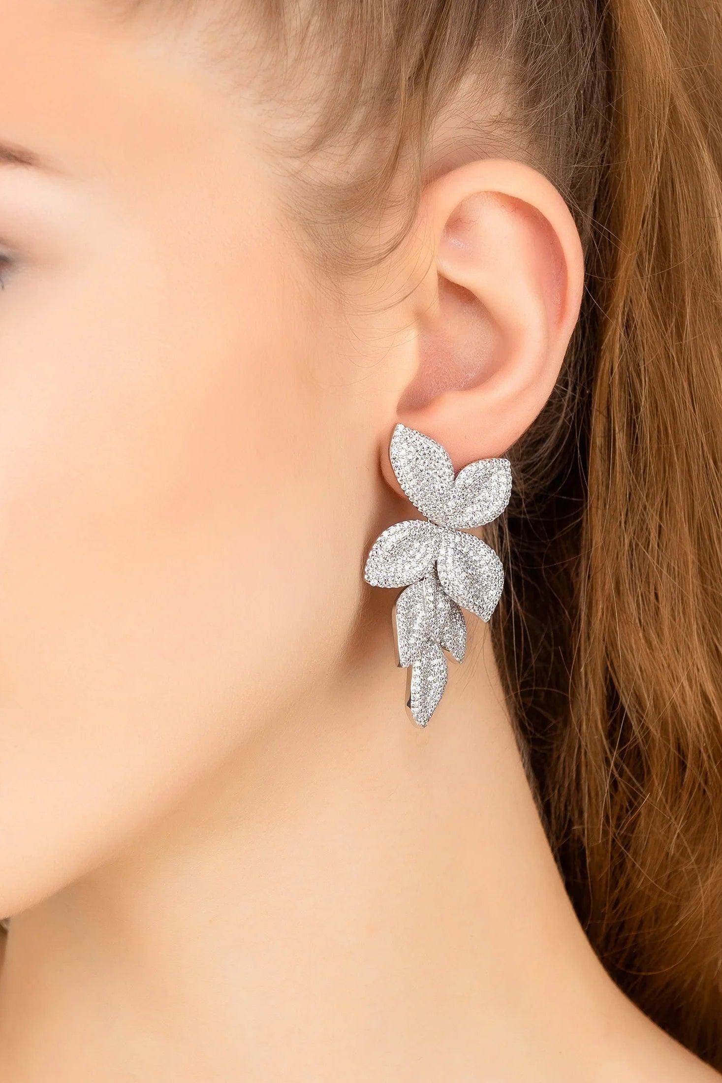 The earring worn by a model.