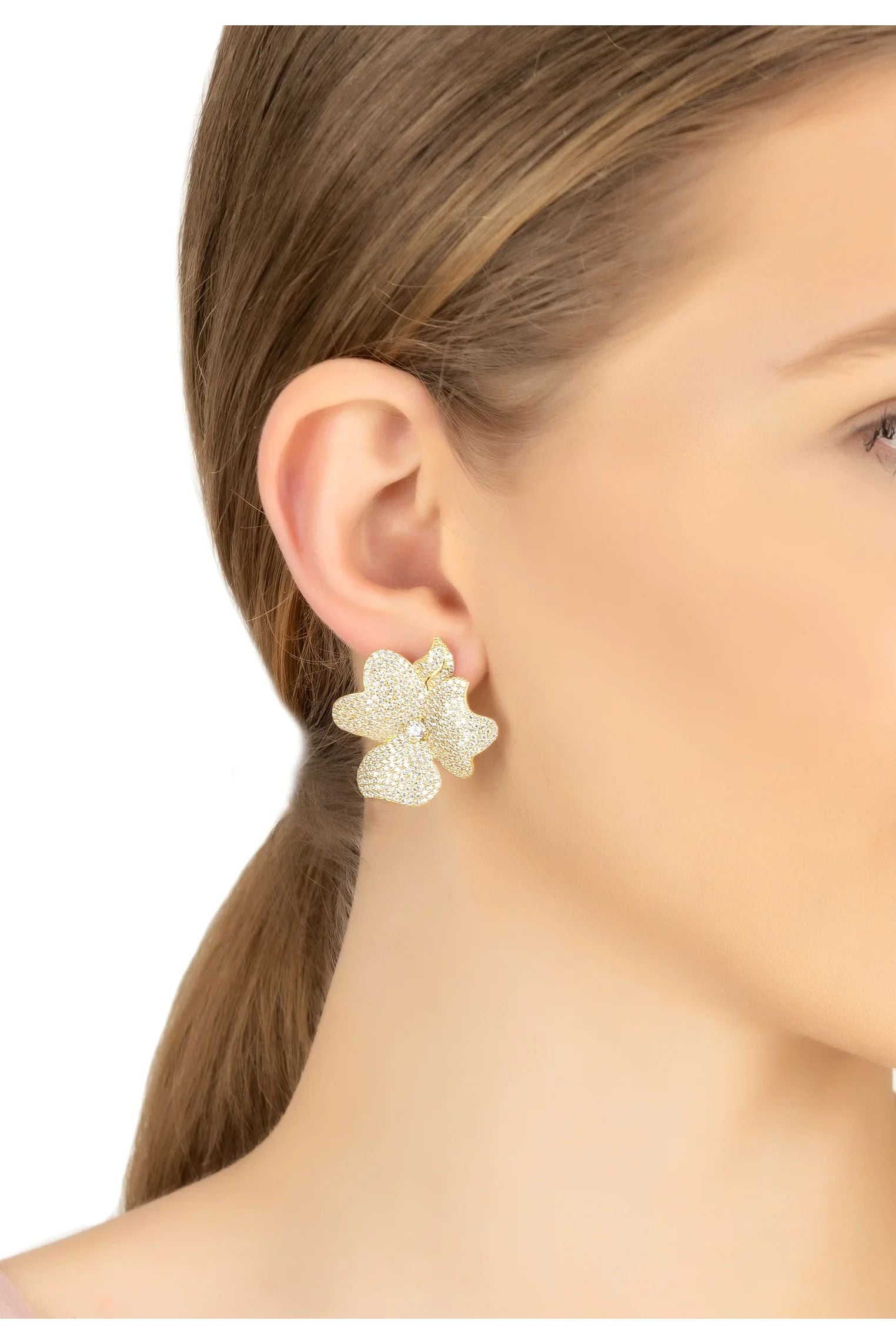 The earring worn by a model.