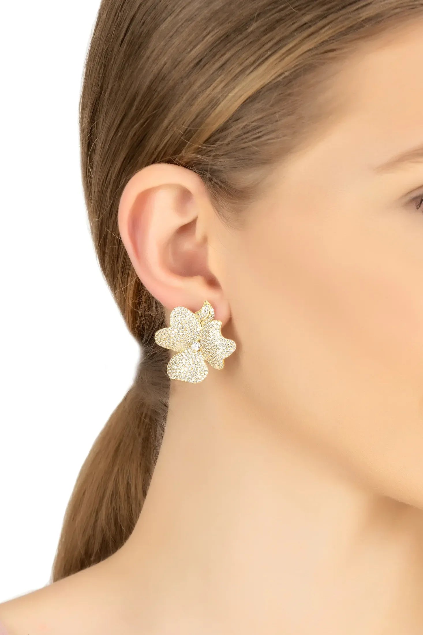 The earring worn by a model.